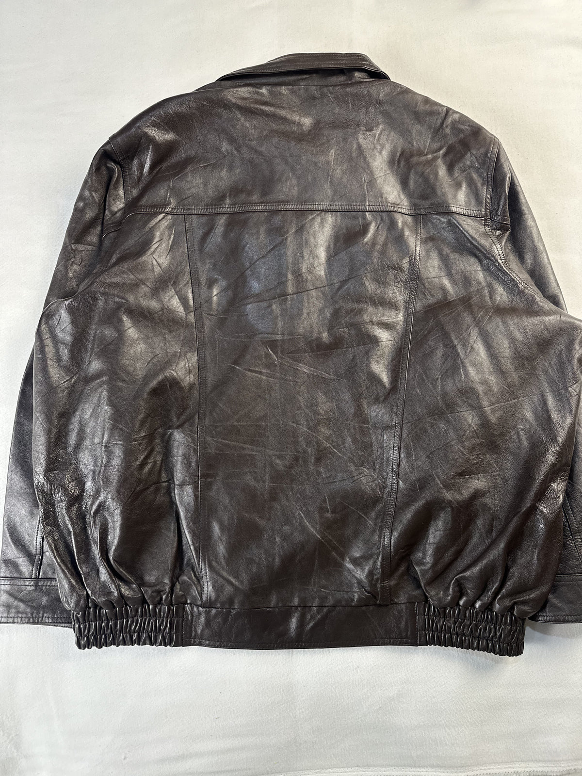Back of the roomy XXL brown jacket showing the plain panel and elasticated hem