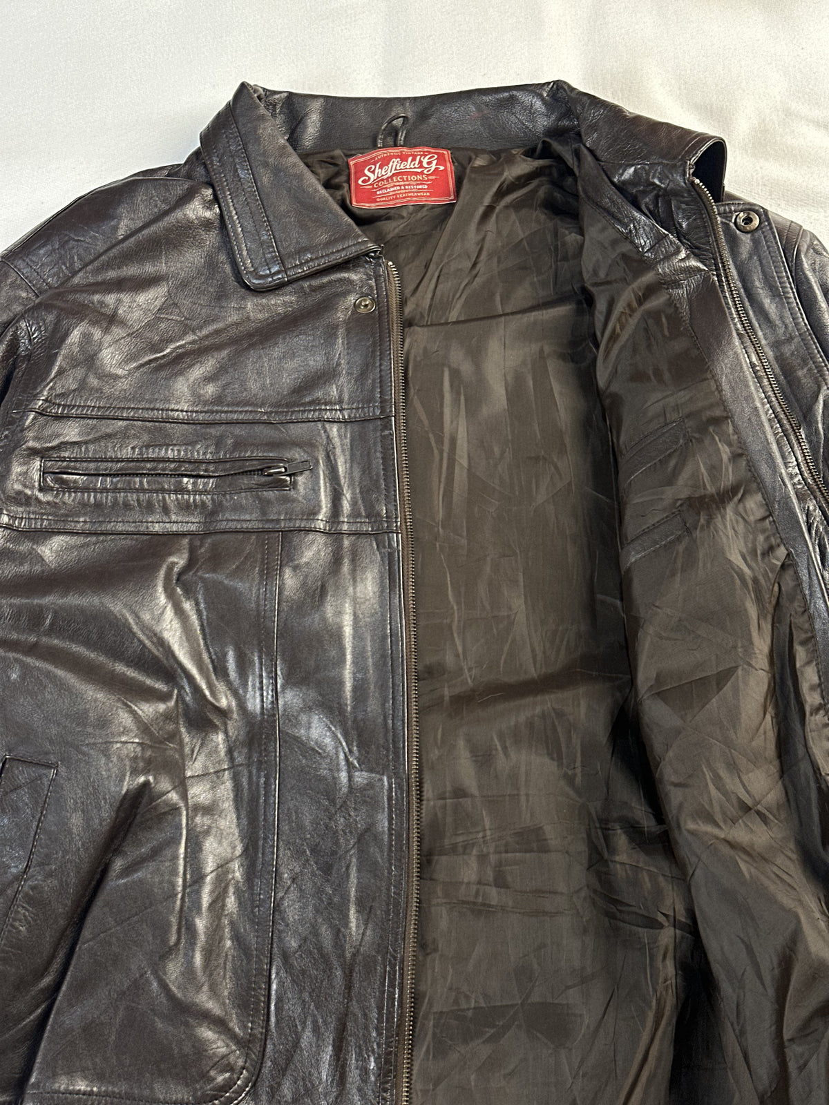 Brown Harrington opened out to show the lining, collar and zipped chest pockets