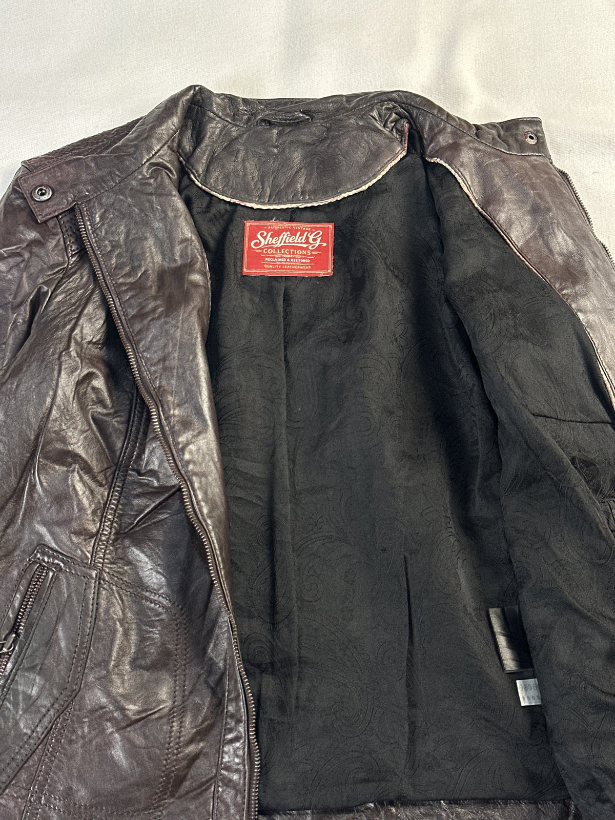 Brown real leather cafe racer with a 25 inch sleeve, size M