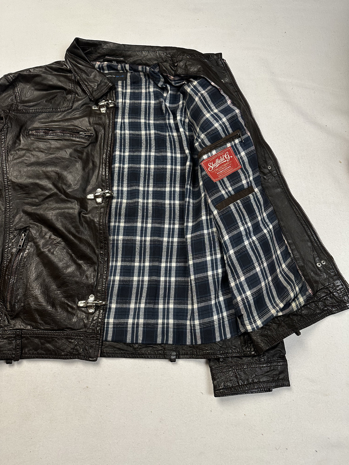 The size XL brown jacket, 26 inches long through the body
