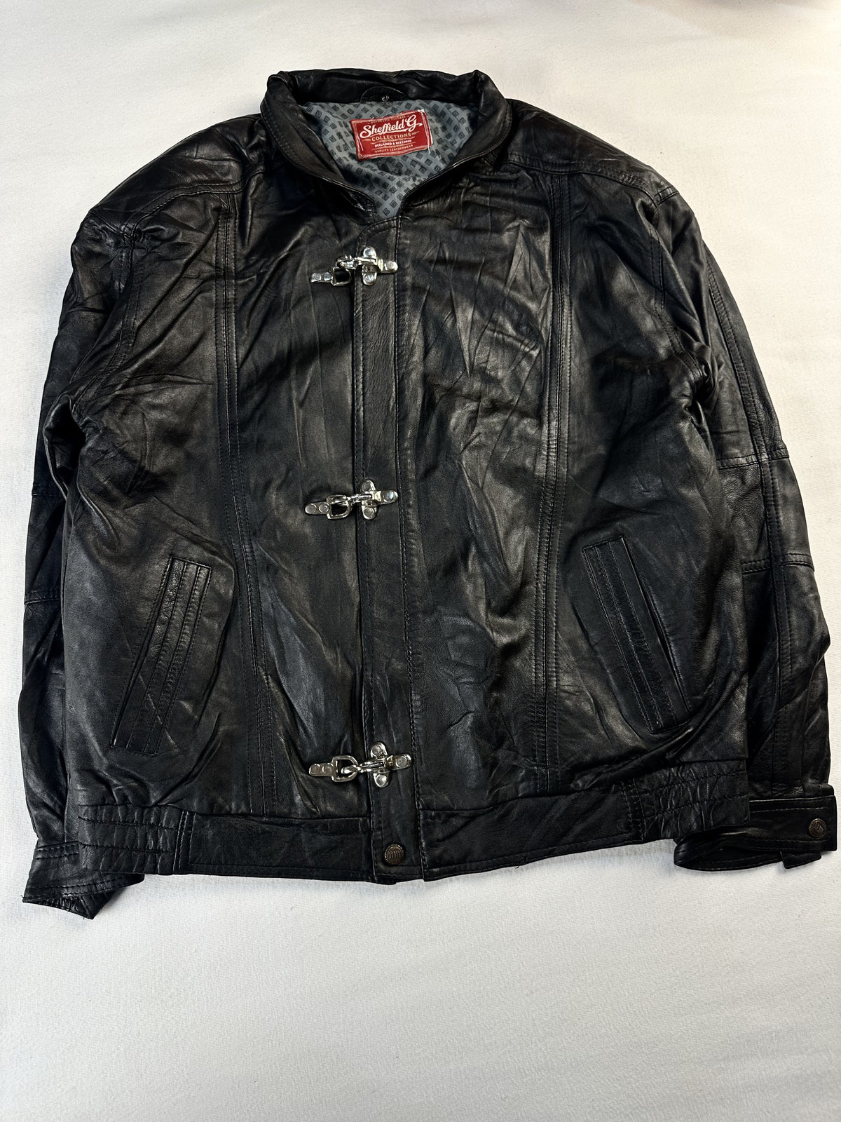 Black leather vintage jacket, size L - chest and pocket detail.