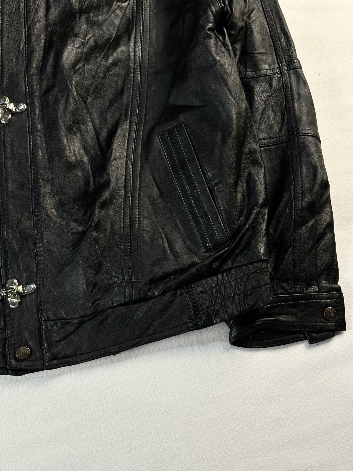 Black leather vintage jacket, size L - size and label context.
