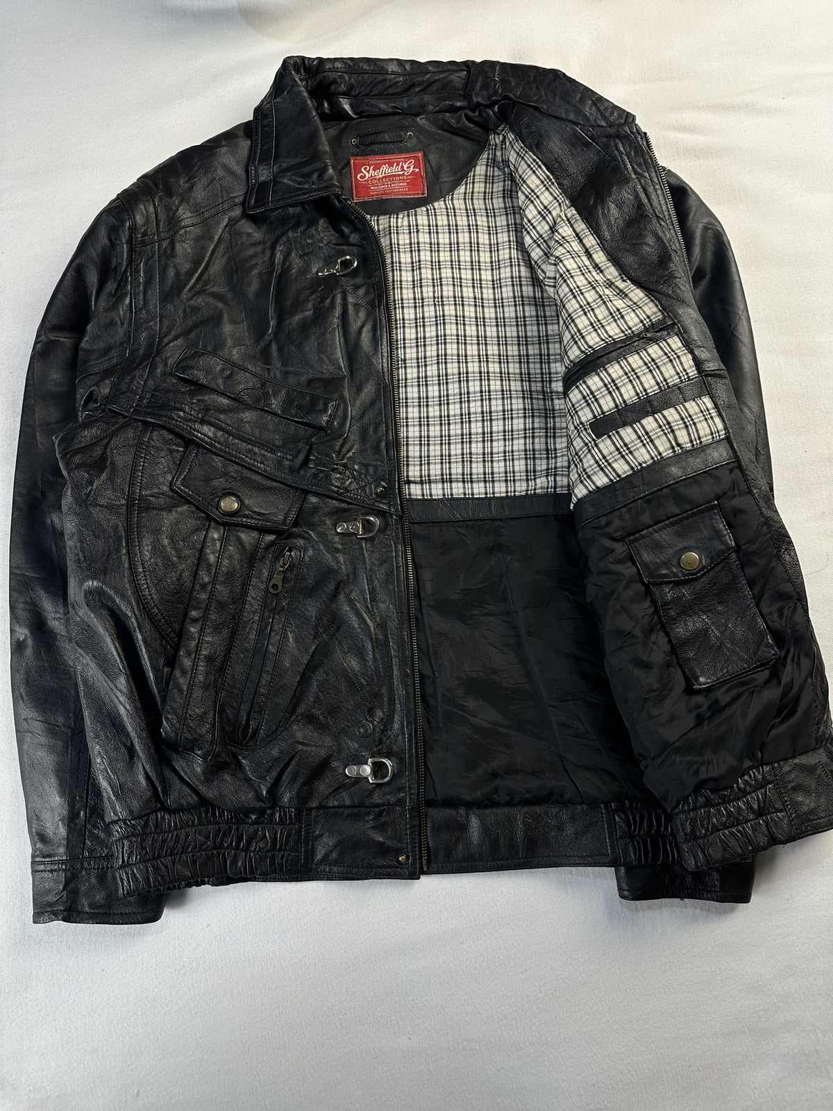 Black leather vintage jacket, size XL - cuff and hem detail.