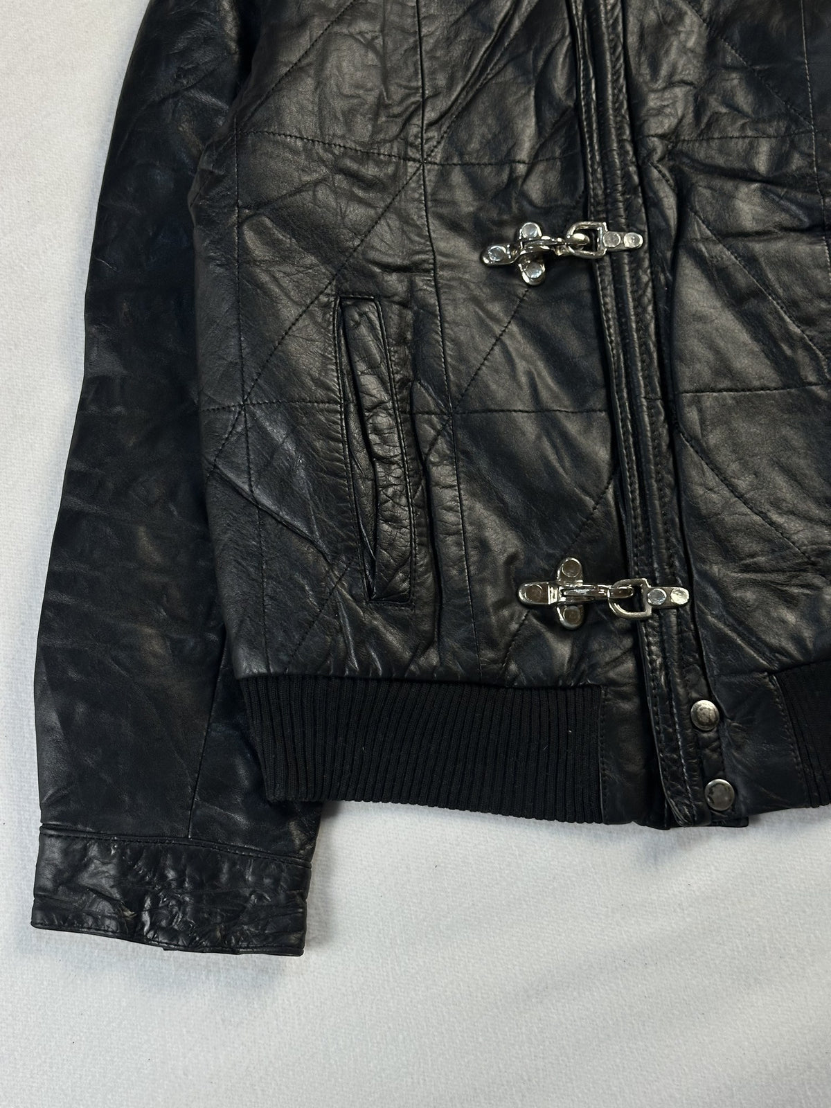 Black leather bomber jacket, size S - sleeve and cuff.