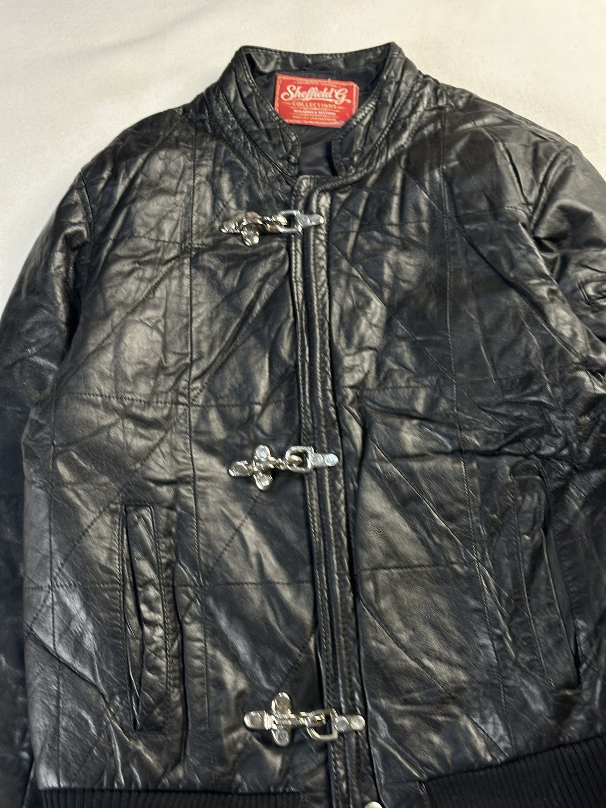 Black leather bomber jacket, size S - back view.