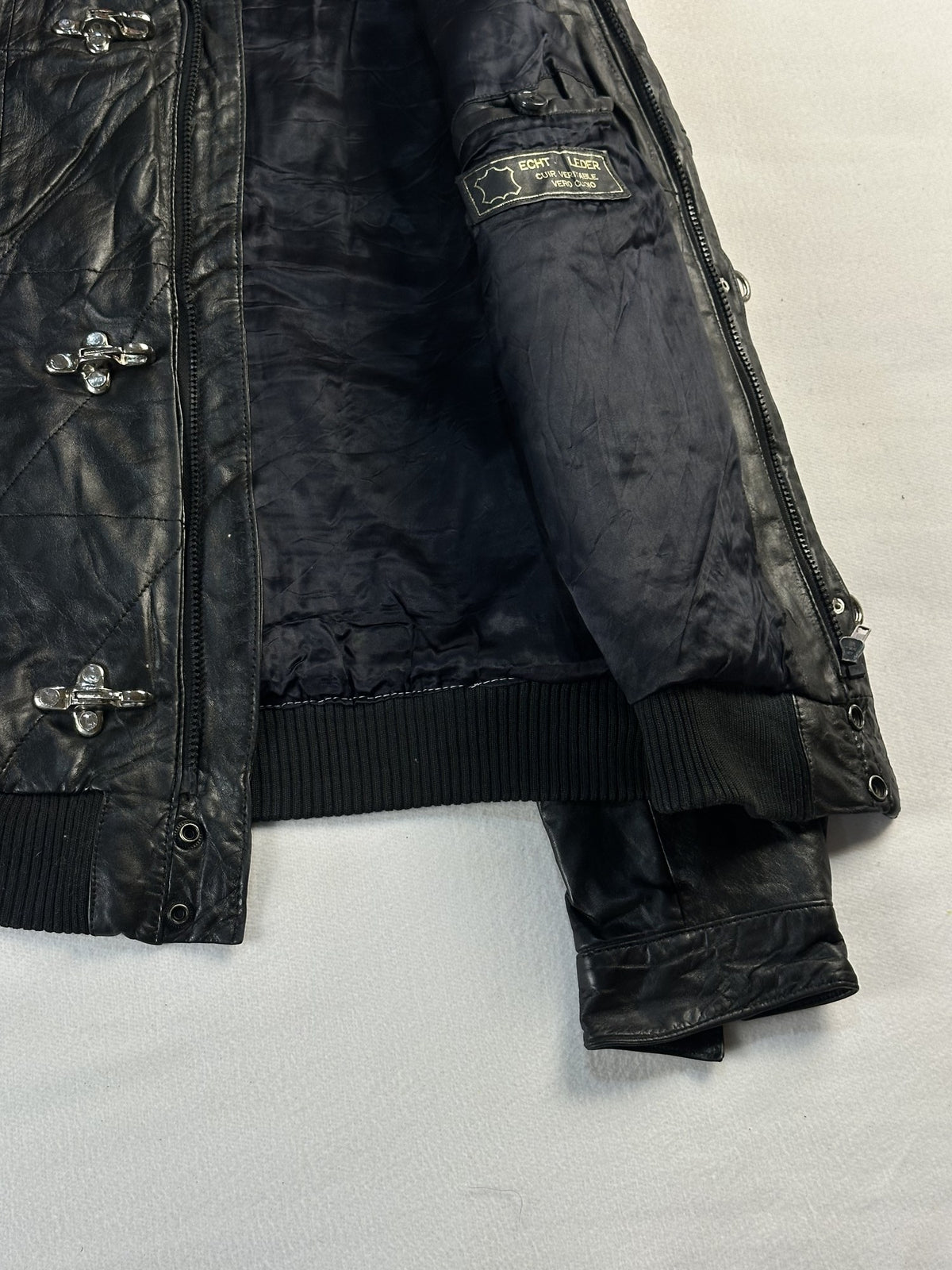 Black leather bomber jacket, size S - interior lining.