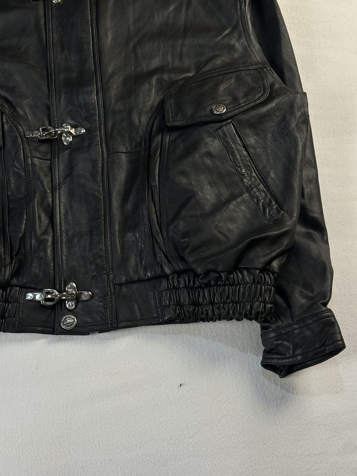Black leather vintage jacket, size L - size and label context.