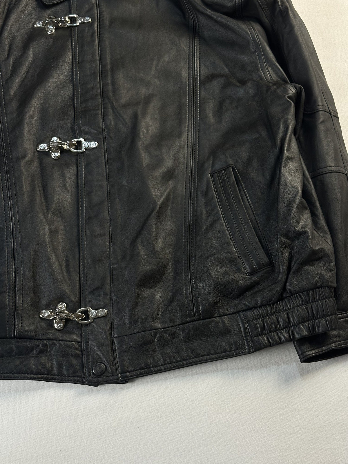 Black leather vintage jacket, size L - size and label context.