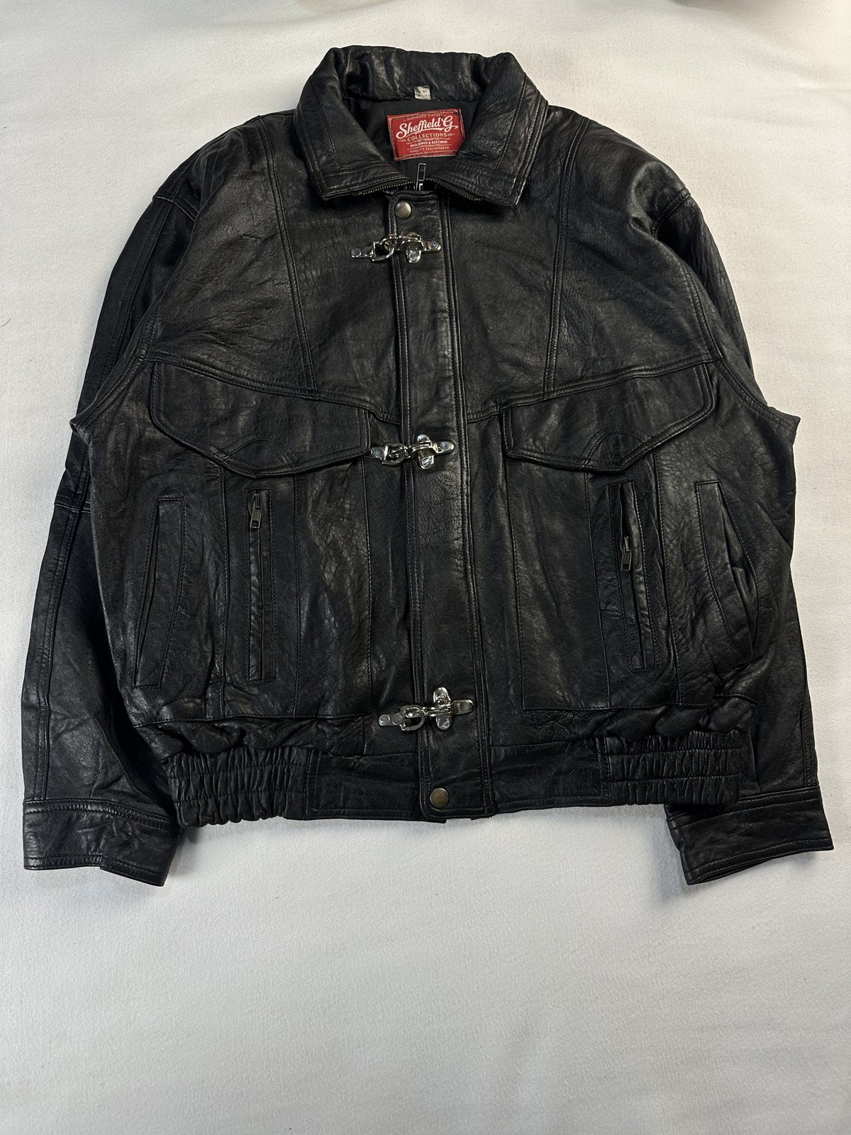Black leather vintage jacket, size M - chest and pocket detail.