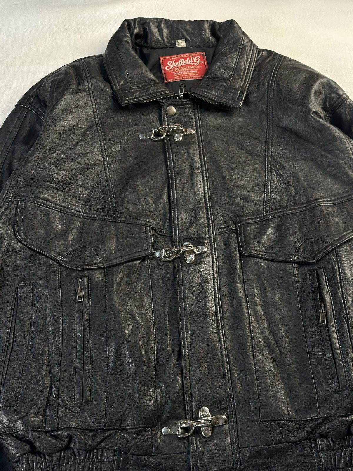 Black leather vintage jacket, size M - back view.