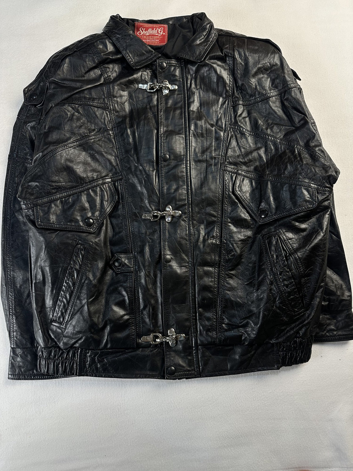 Black leather vintage jacket, size L - chest and pocket detail.