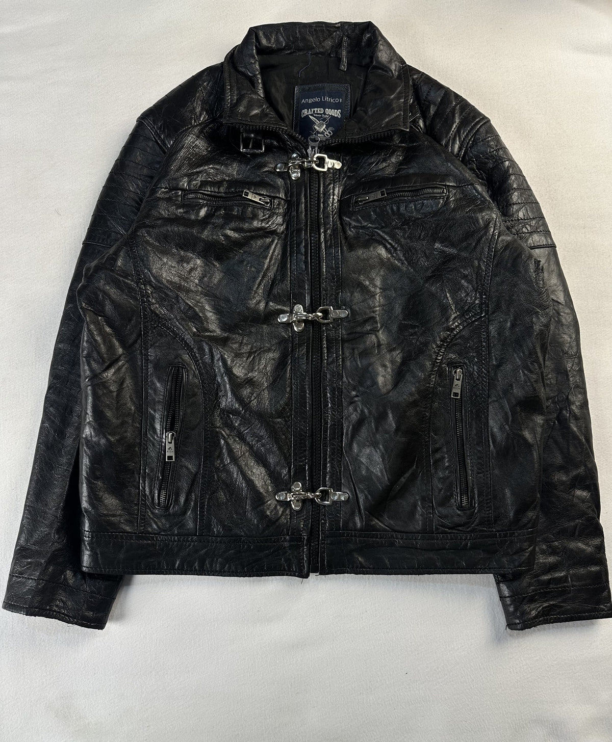 Black leather vintage jacket, size M - chest and pocket detail.