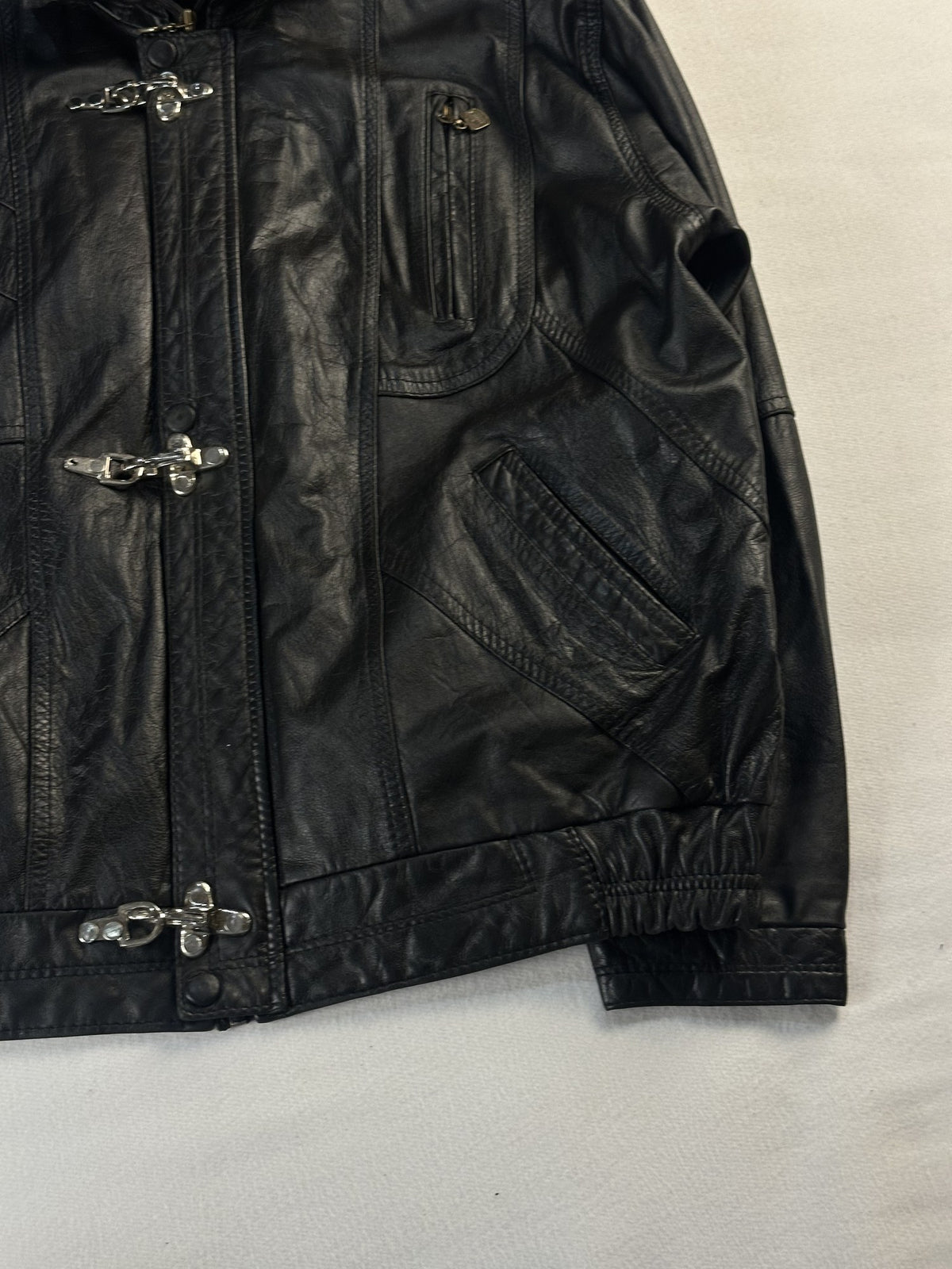 Black leather vintage jacket, size L - size and label context.
