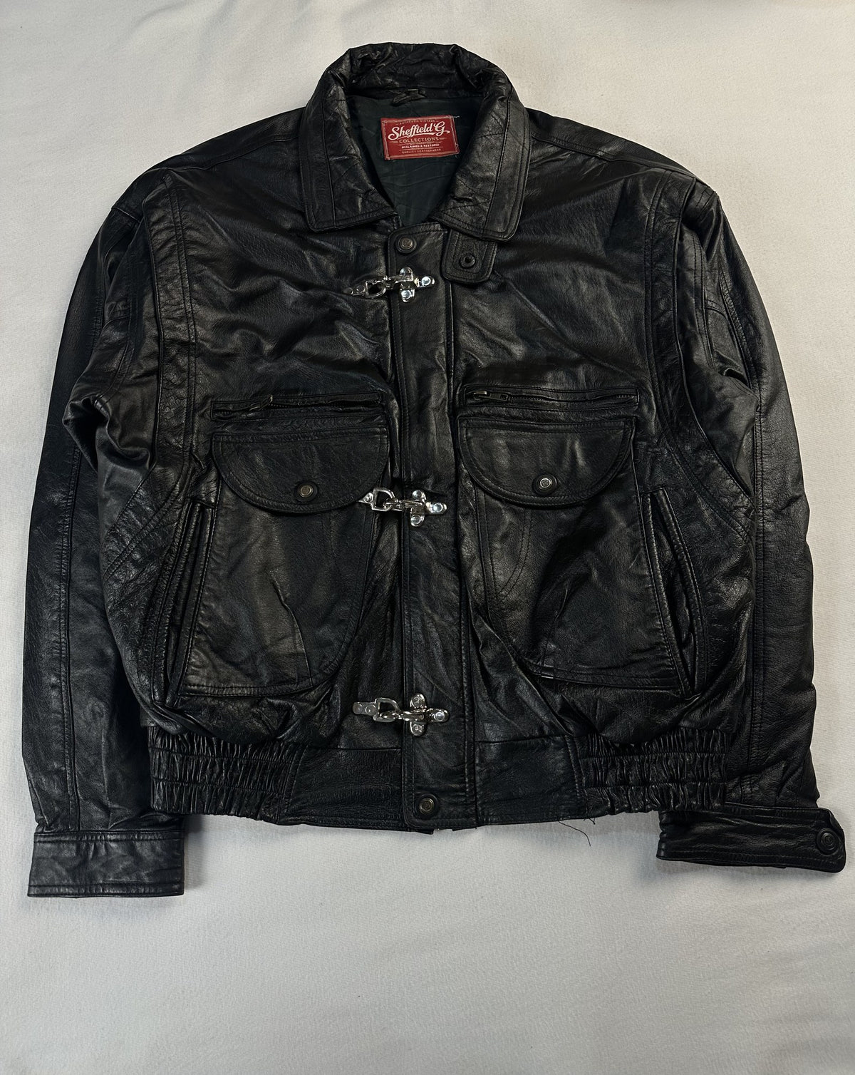 Black leather vintage jacket, size M - chest and pocket detail.