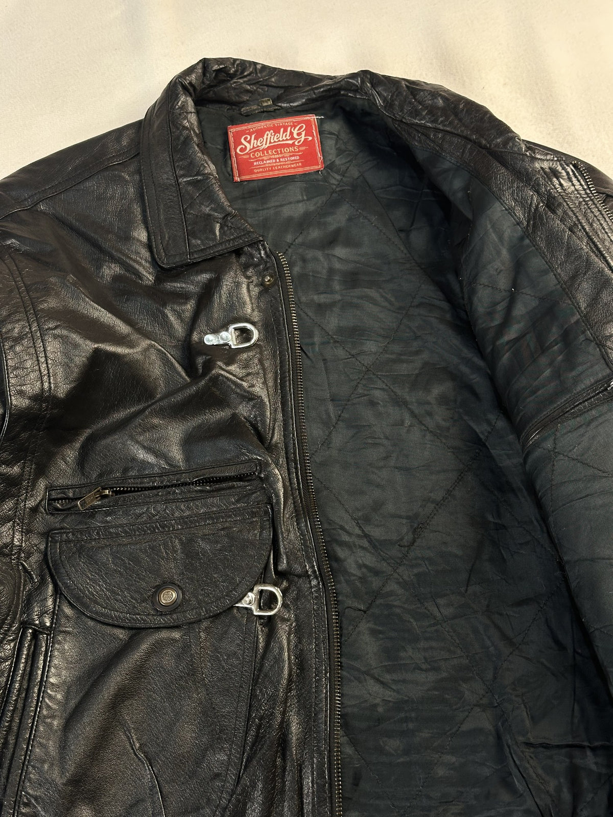 Black leather vintage jacket, size M - cuff and hem detail.