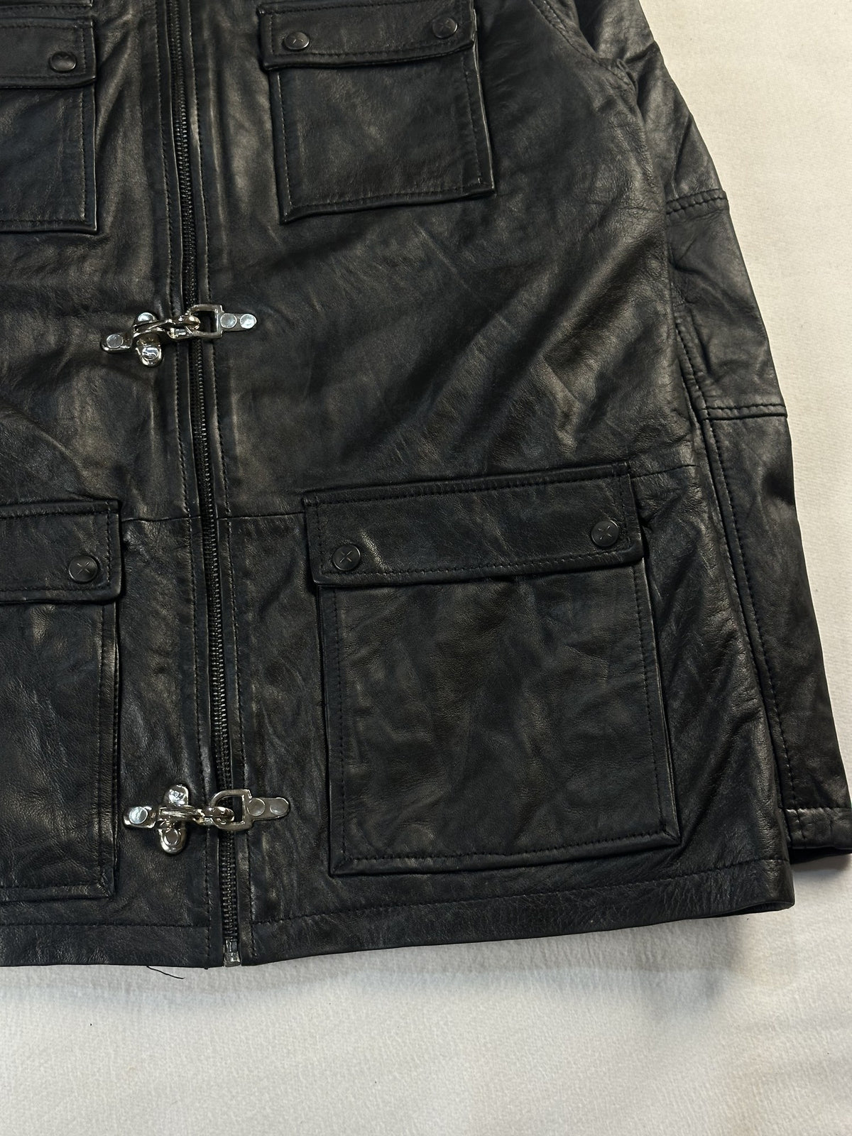 Black leather field jacket, size L - size and label context.