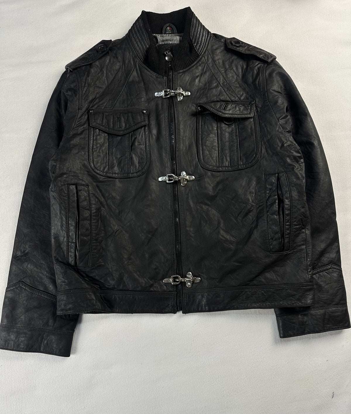 Black leather bomber jacket, size L - chest and pocket detail.