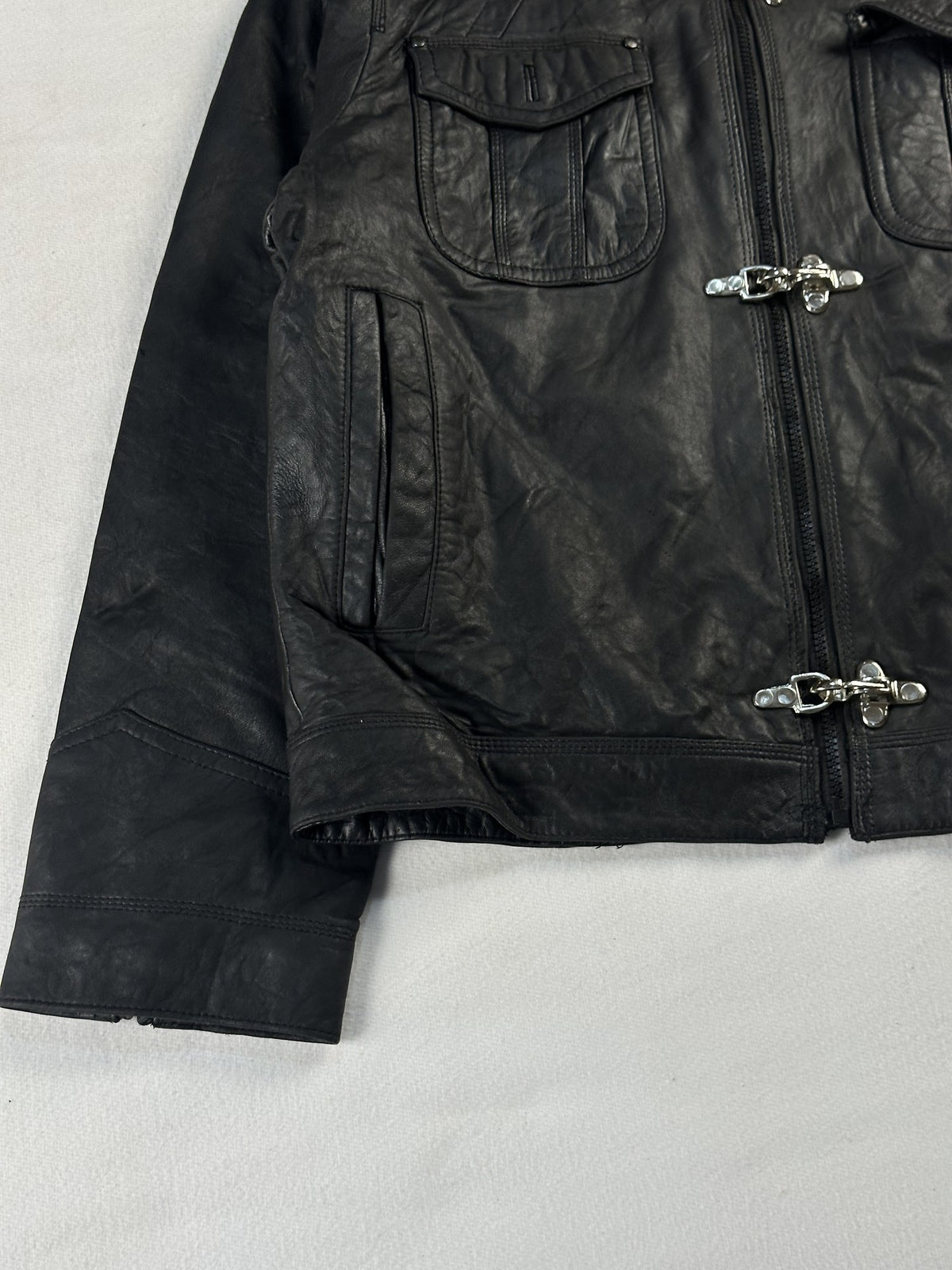 Black leather bomber jacket, size L - sleeve and cuff.