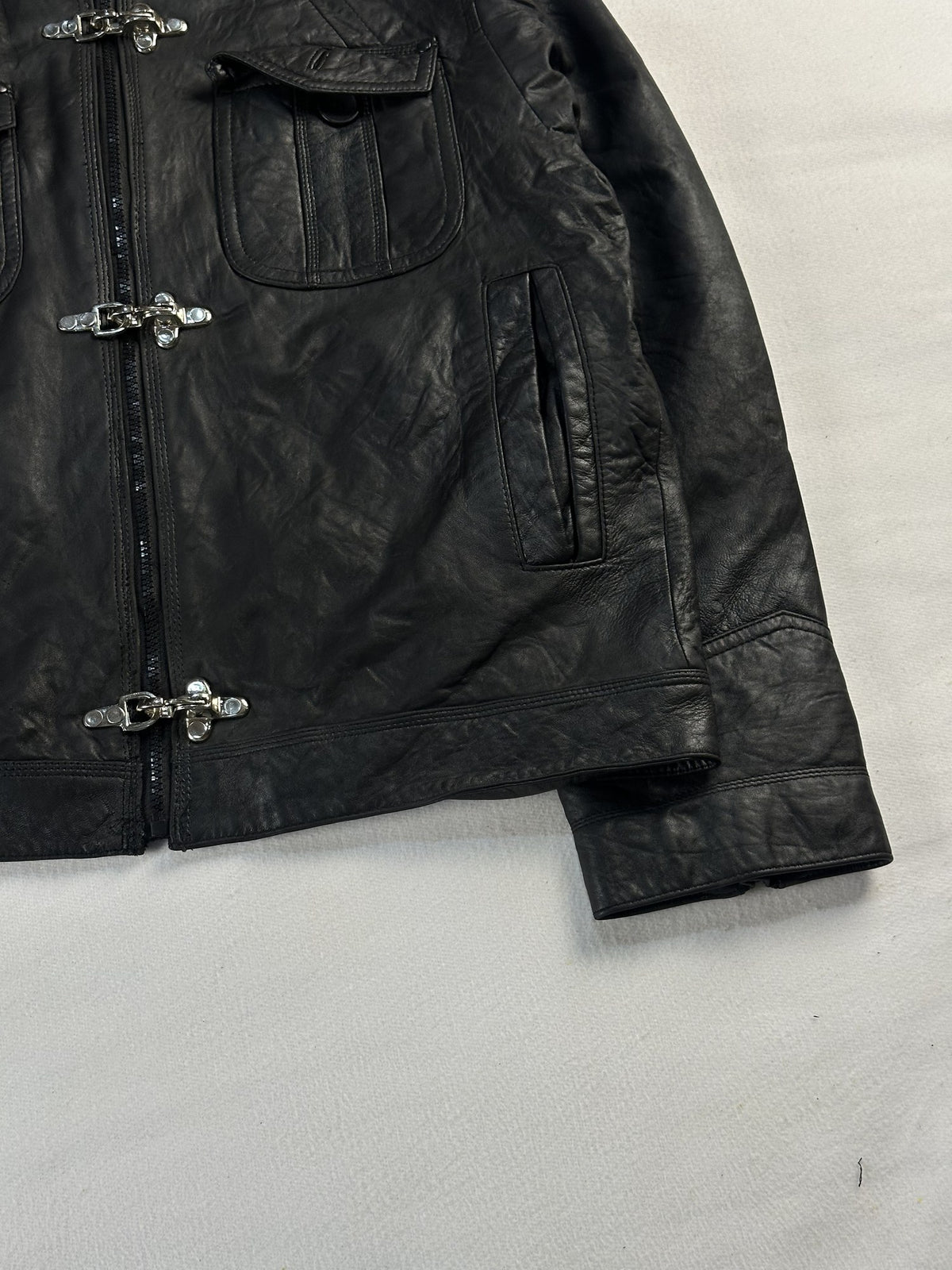 Black leather bomber jacket, size L - size and label context.