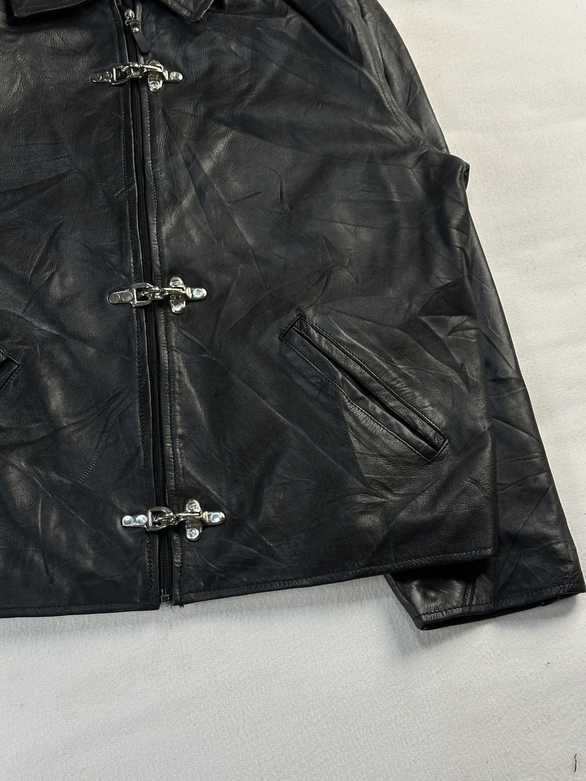 Black leather vintage jacket, size L - size and label context.