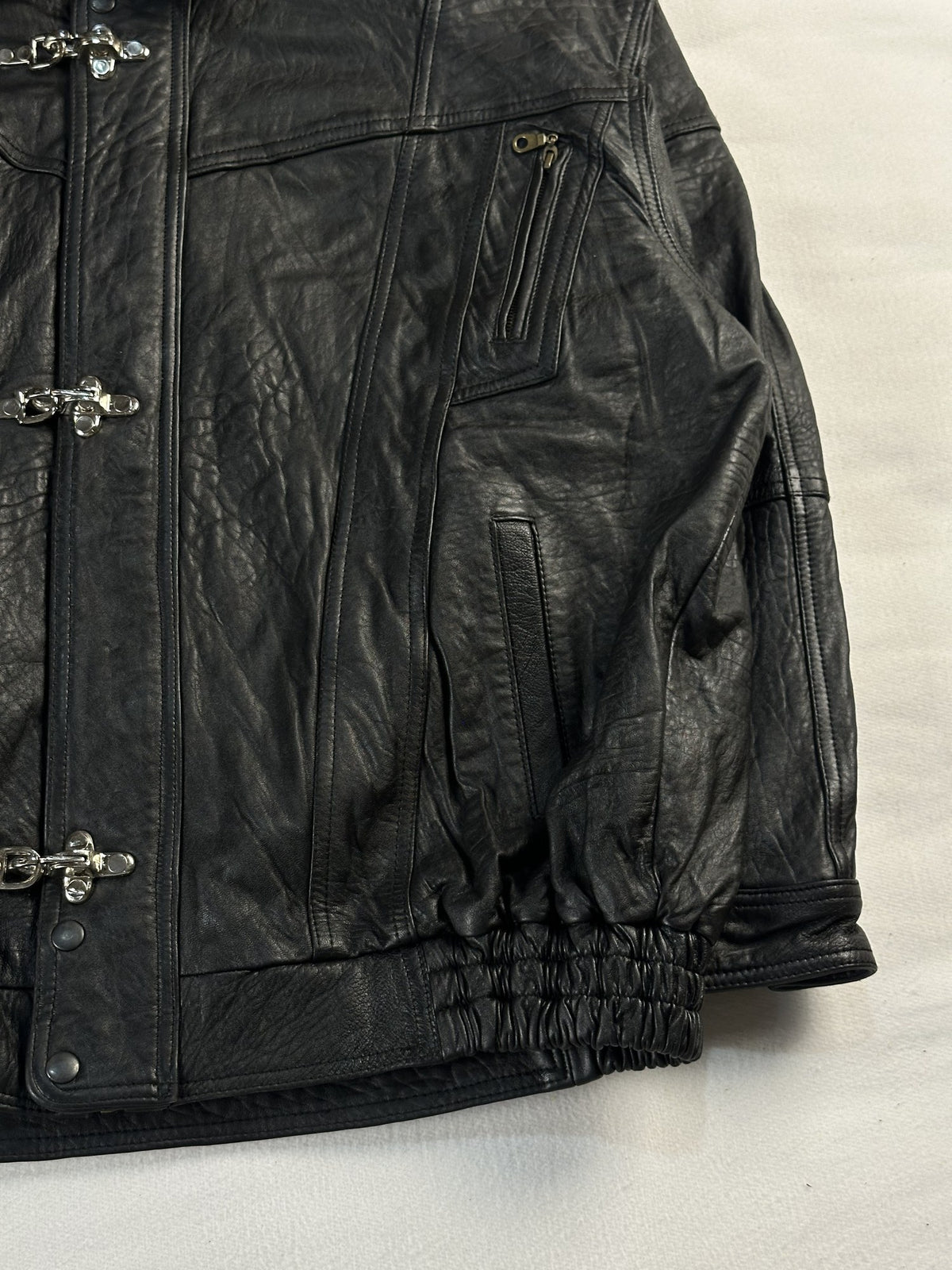 Black leather vintage jacket, size L - size and label context.