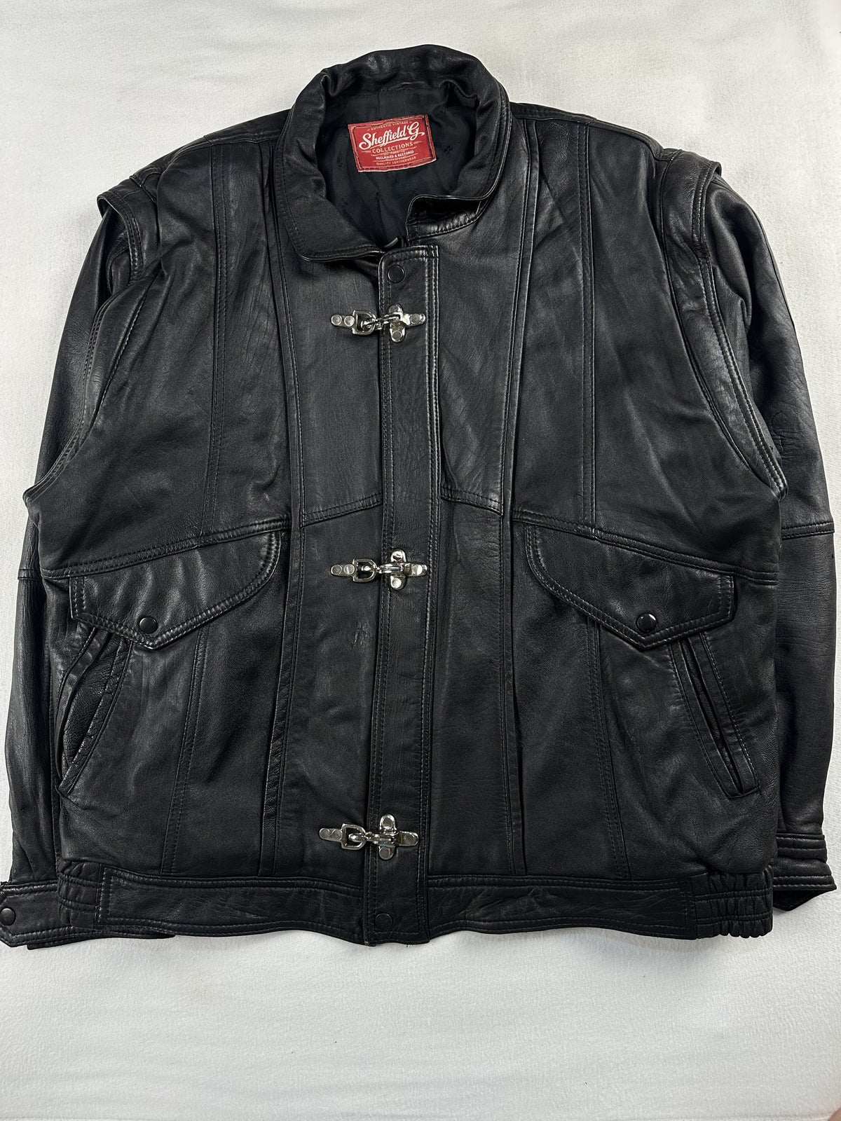 Black leather vintage jacket, size L - chest and pocket detail.