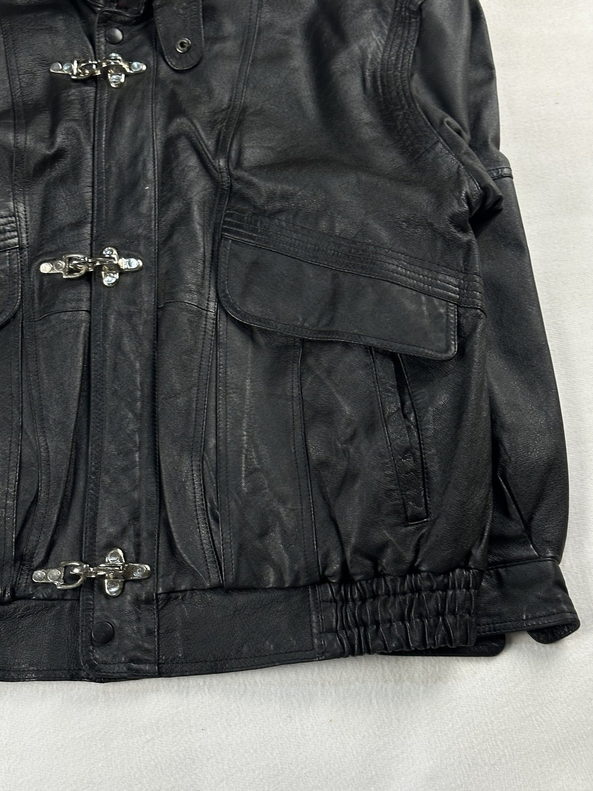 Black leather field jacket, size L - size and label context.