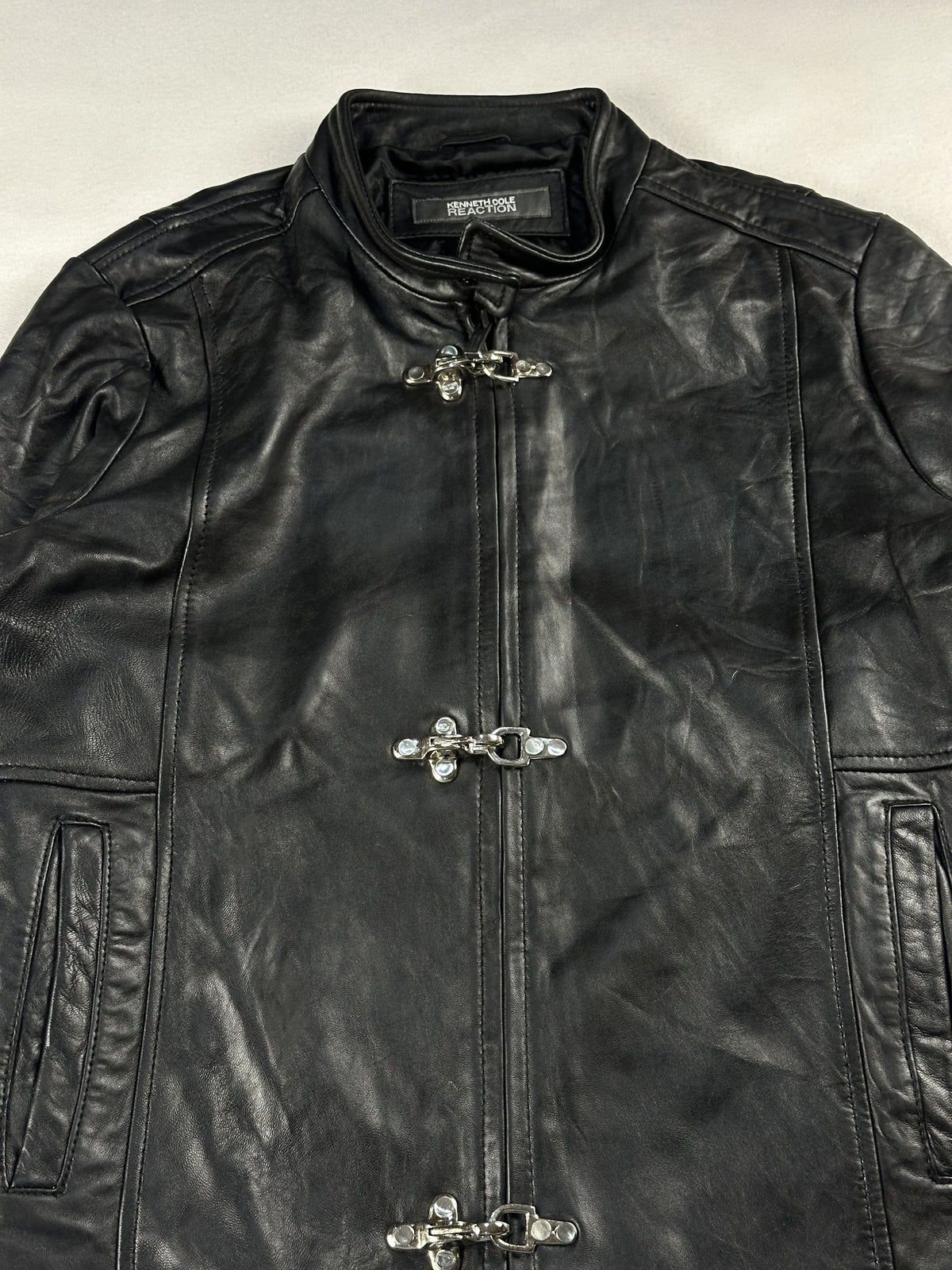 Black leather cafe racer jacket, size M - back view.