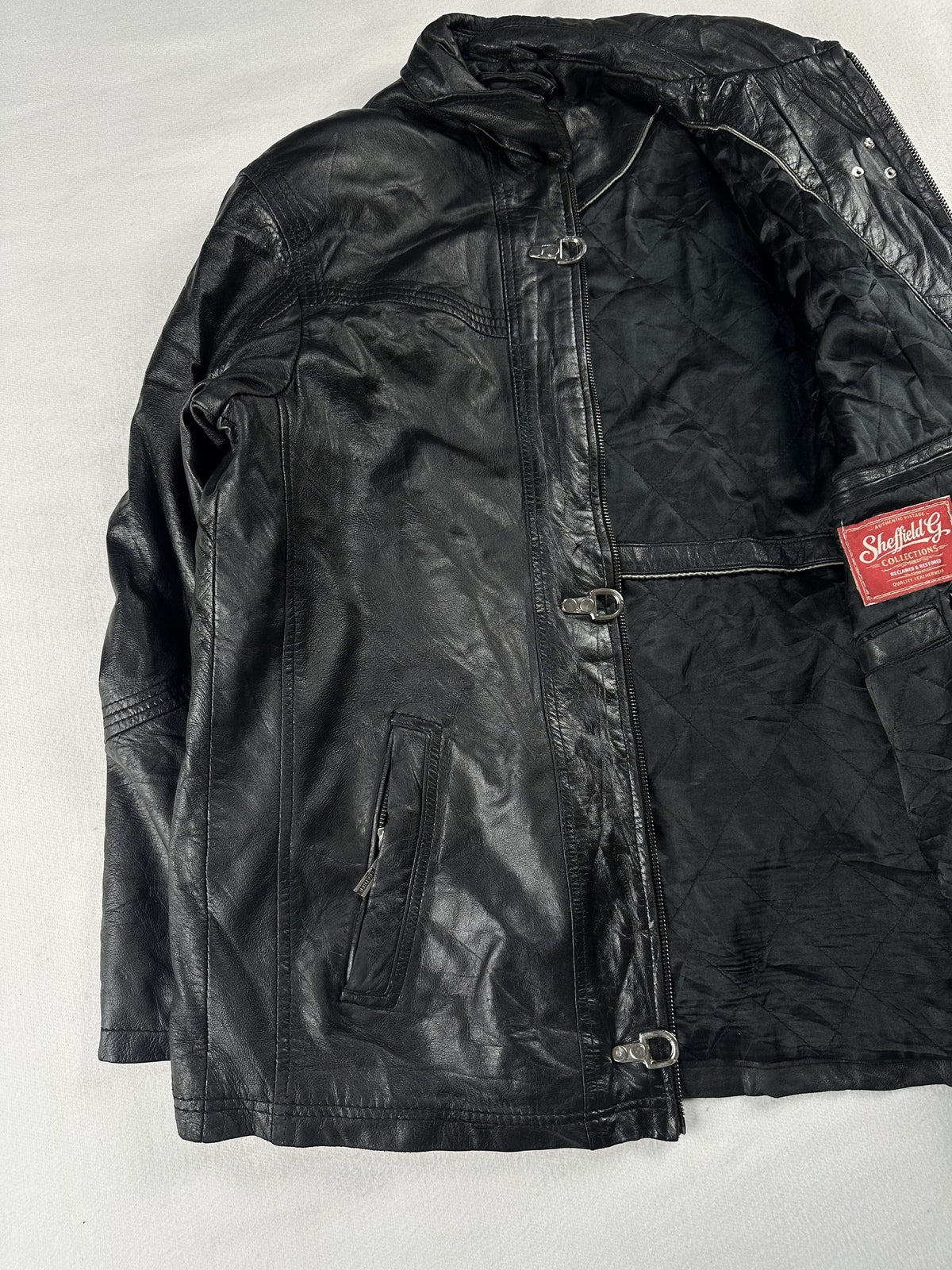Black leather vintage jacket, size L - cuff and hem detail.