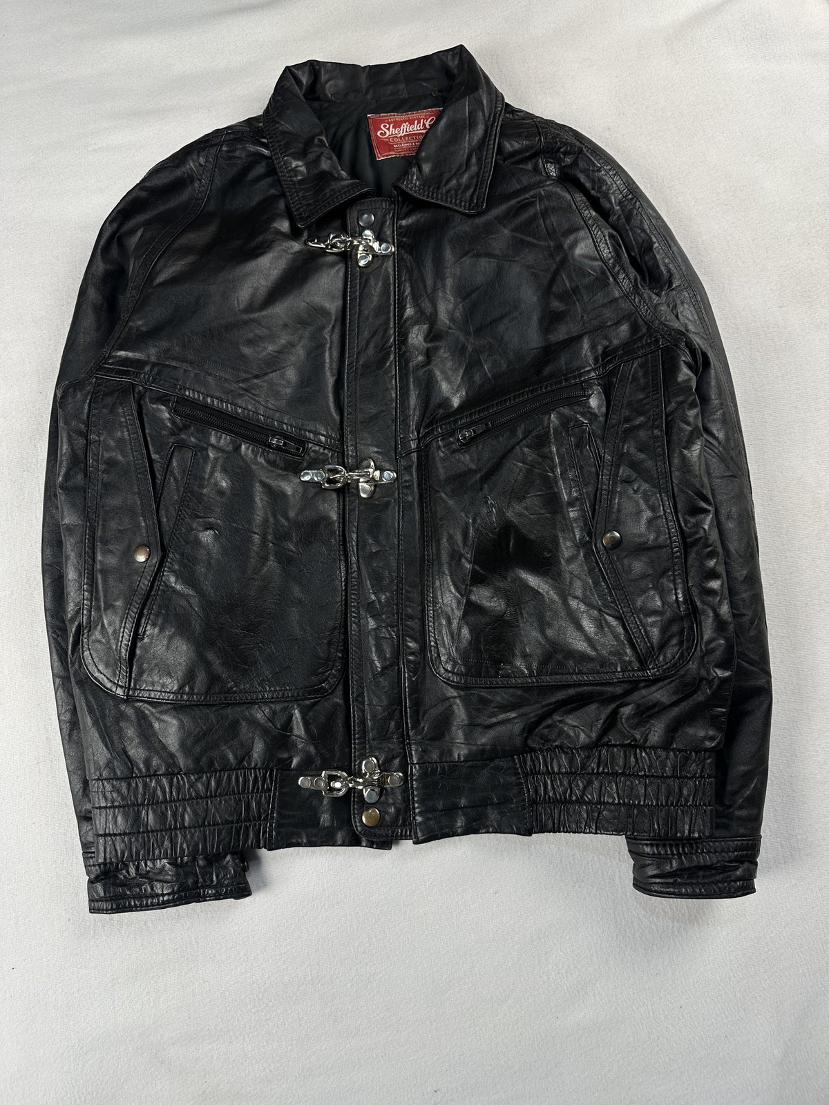 Black leather vintage jacket, size M - chest and pocket detail.