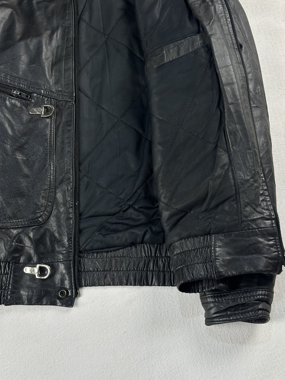 Black leather vintage jacket, size M - size and label context.