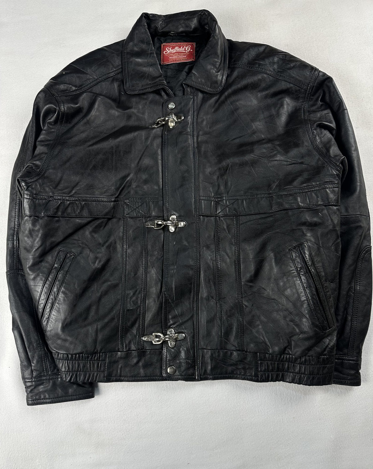 Black leather vintage jacket, size L - chest and pocket detail.
