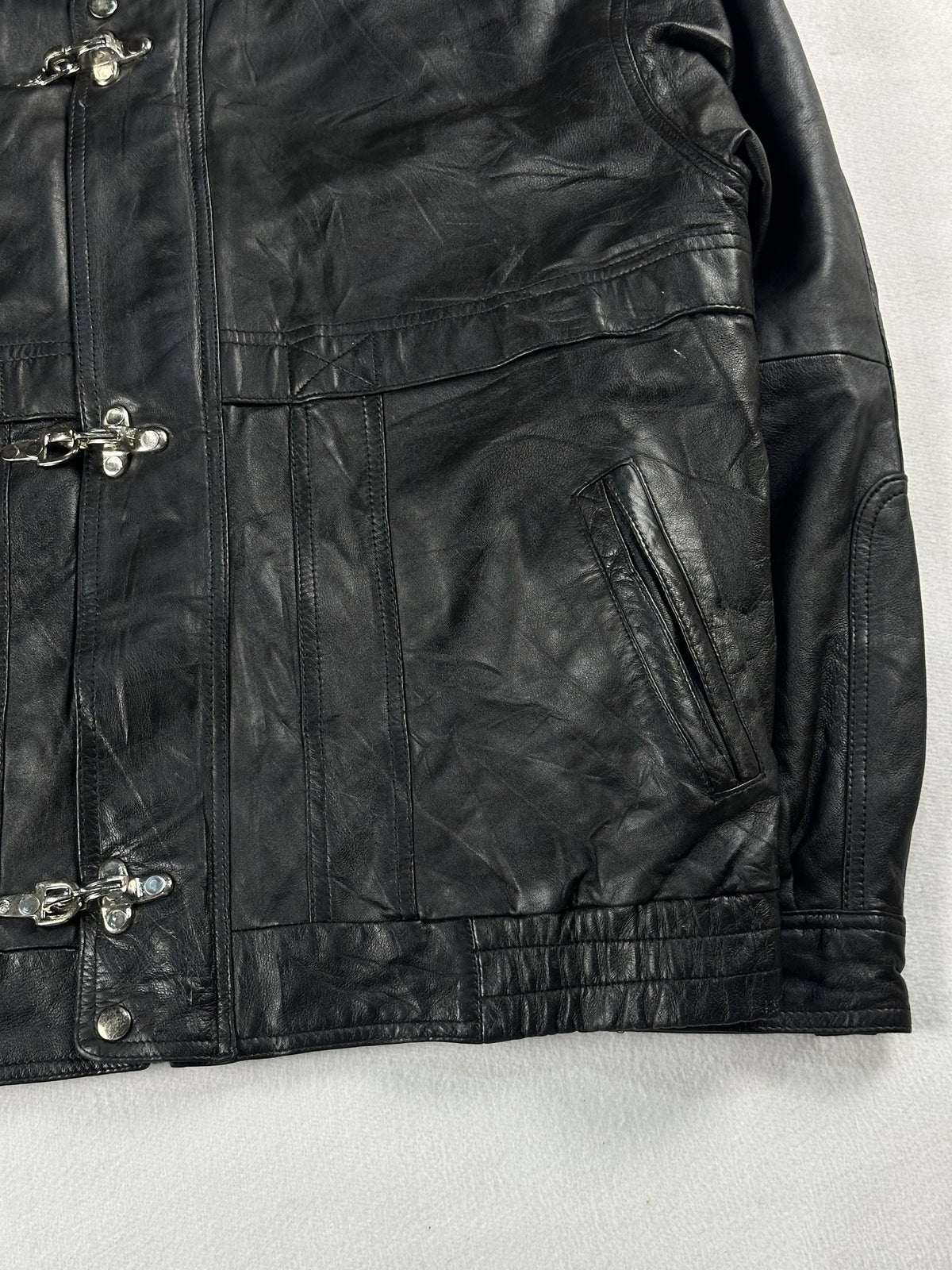 Black leather vintage jacket, size L - size and label context.