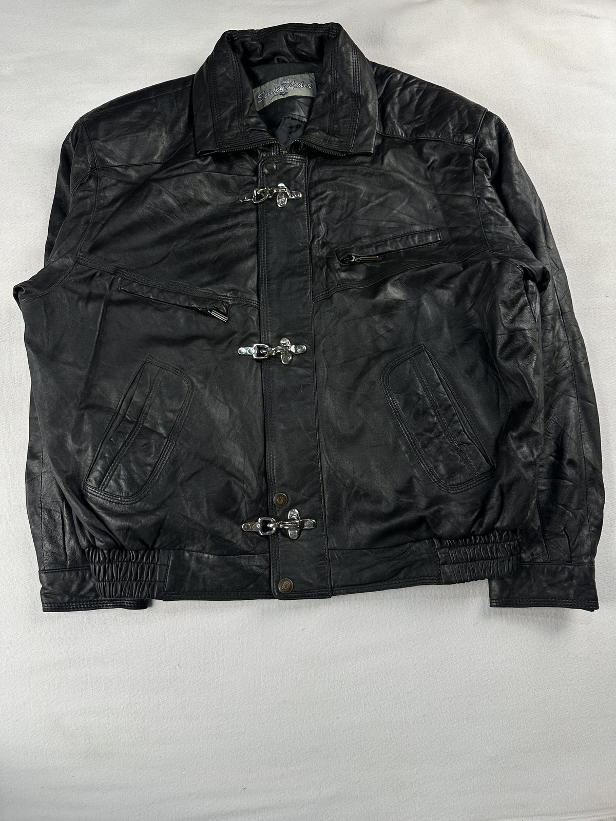 Black leather vintage jacket, size L - chest and pocket detail.