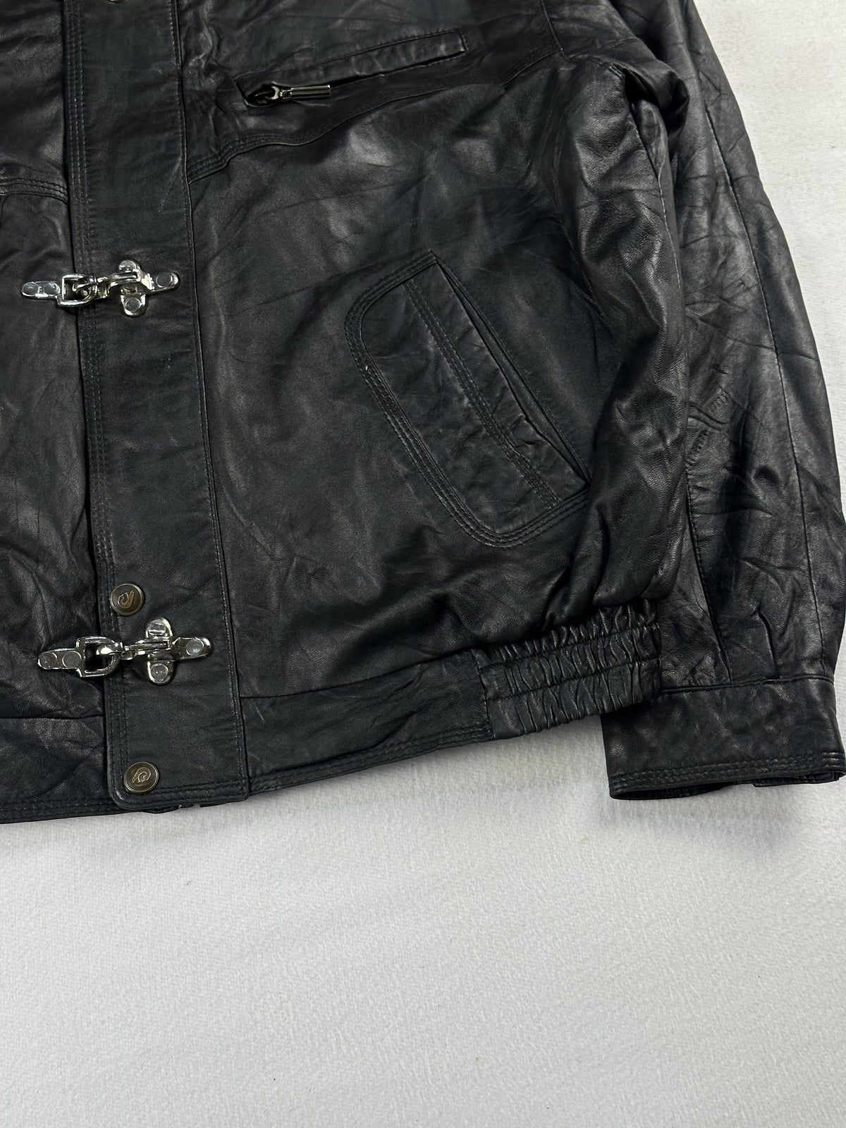 Black leather vintage jacket, size L - size and label context.