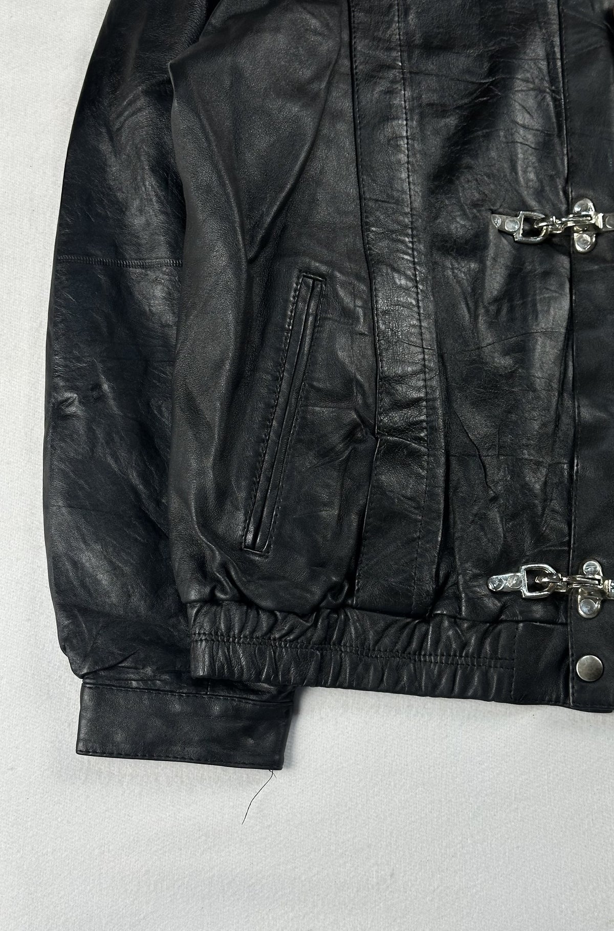 Black leather cafe racer jacket, size L - chest and pocket detail.