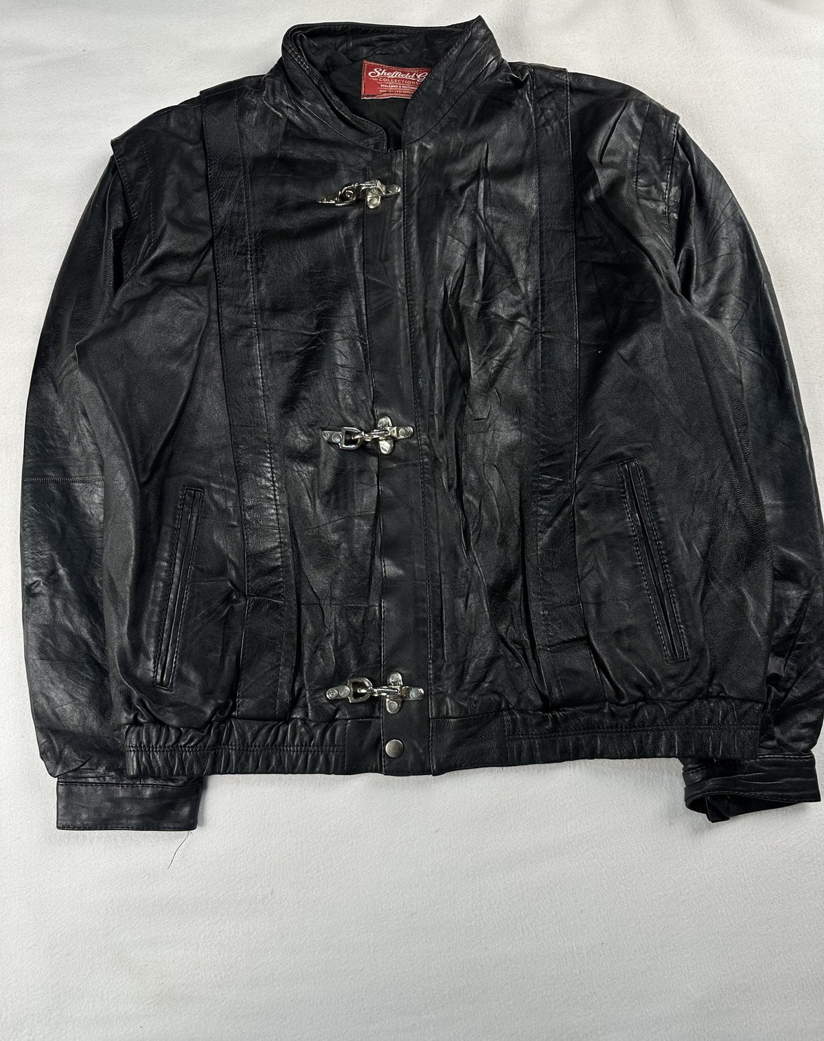 Black leather cafe racer jacket, size L - sleeve and cuff.