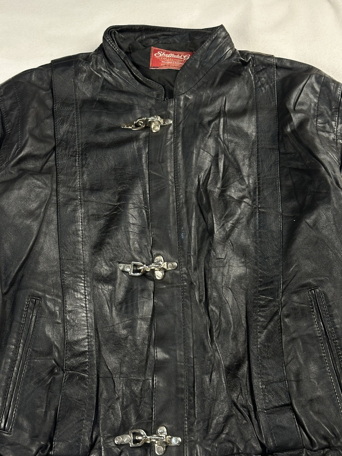 Black leather cafe racer jacket, size L - back view.