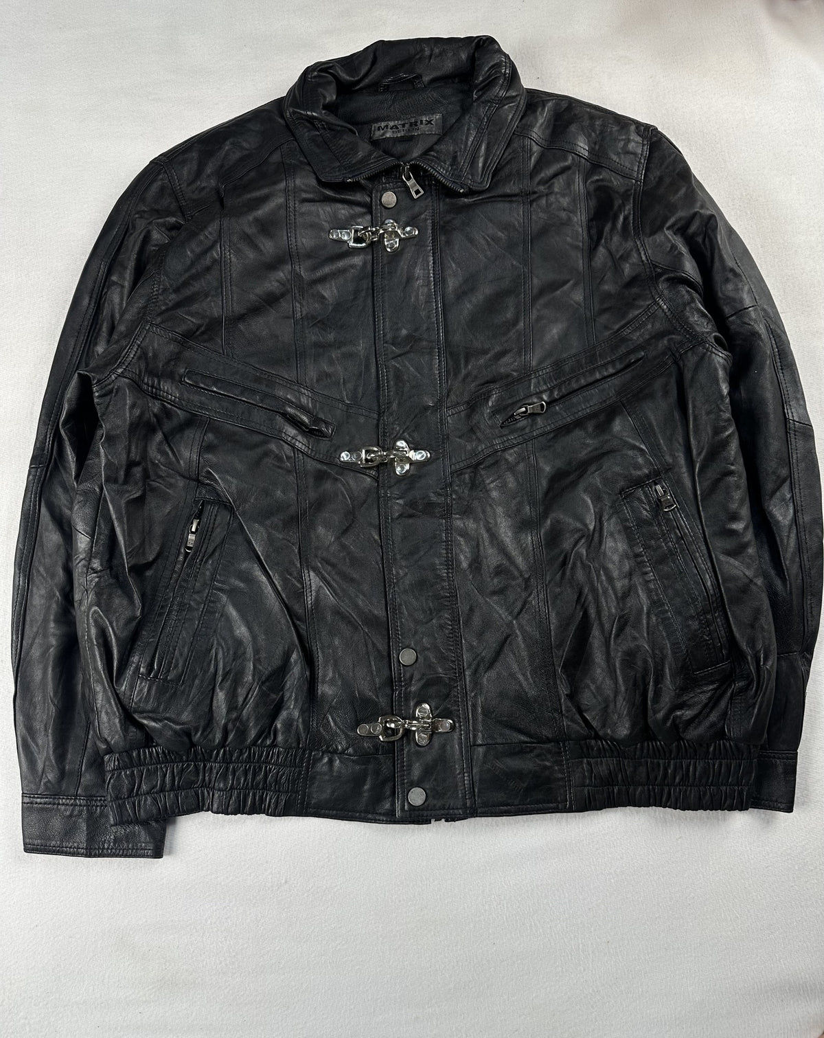 Black leather vintage jacket, size L - chest and pocket detail.