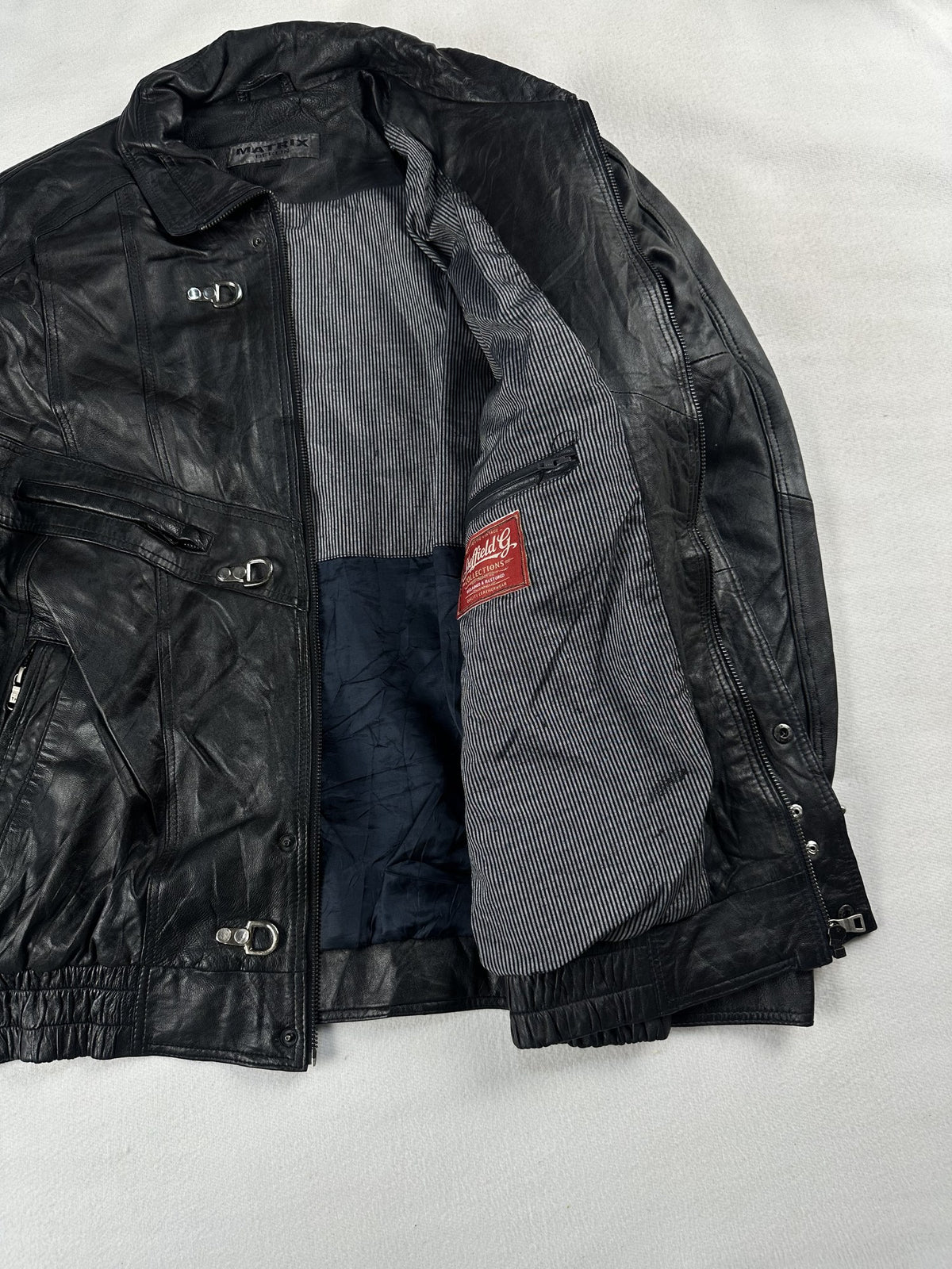Black leather vintage jacket, size L - interior lining.