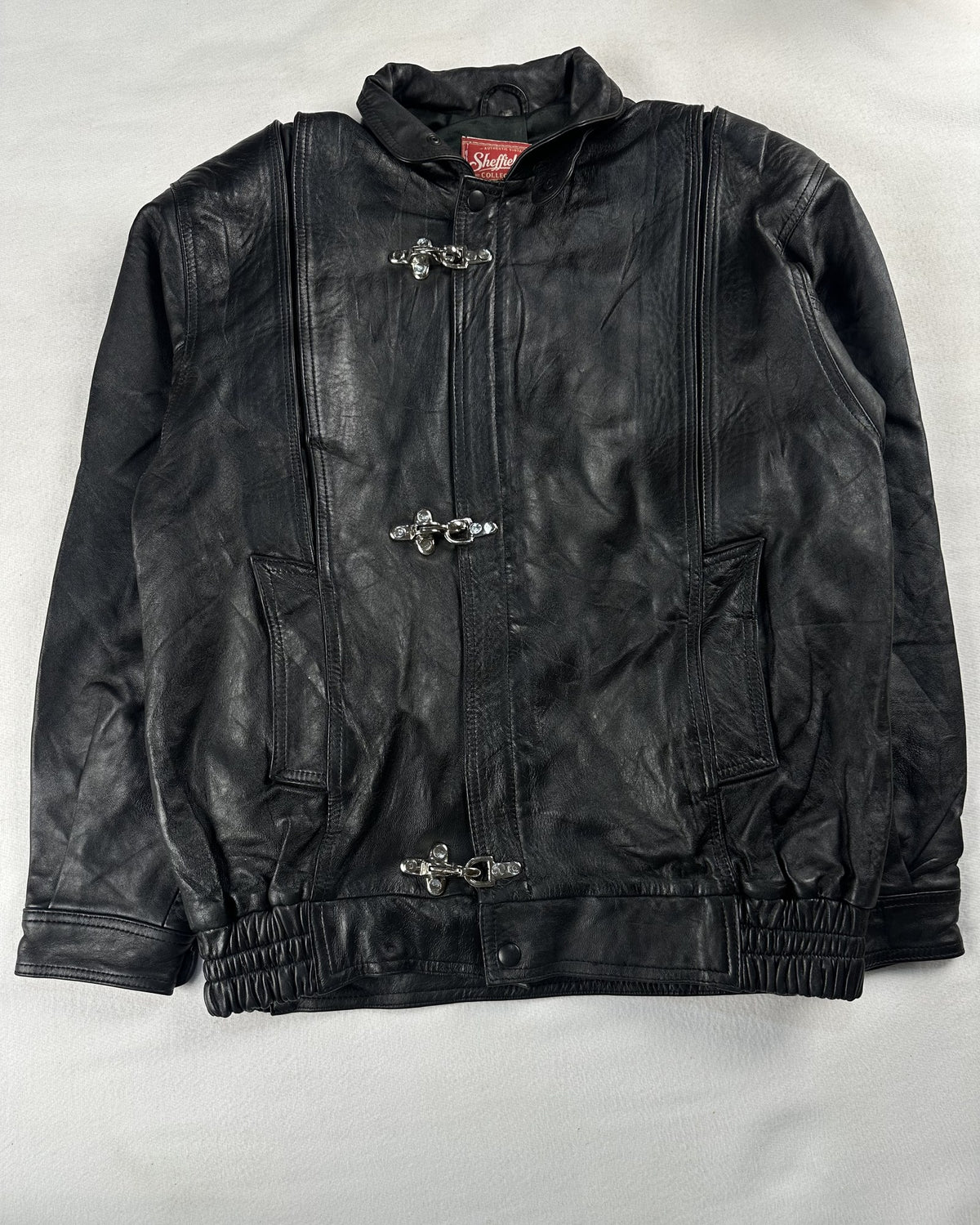 Black leather vintage jacket, size L - chest and pocket detail.