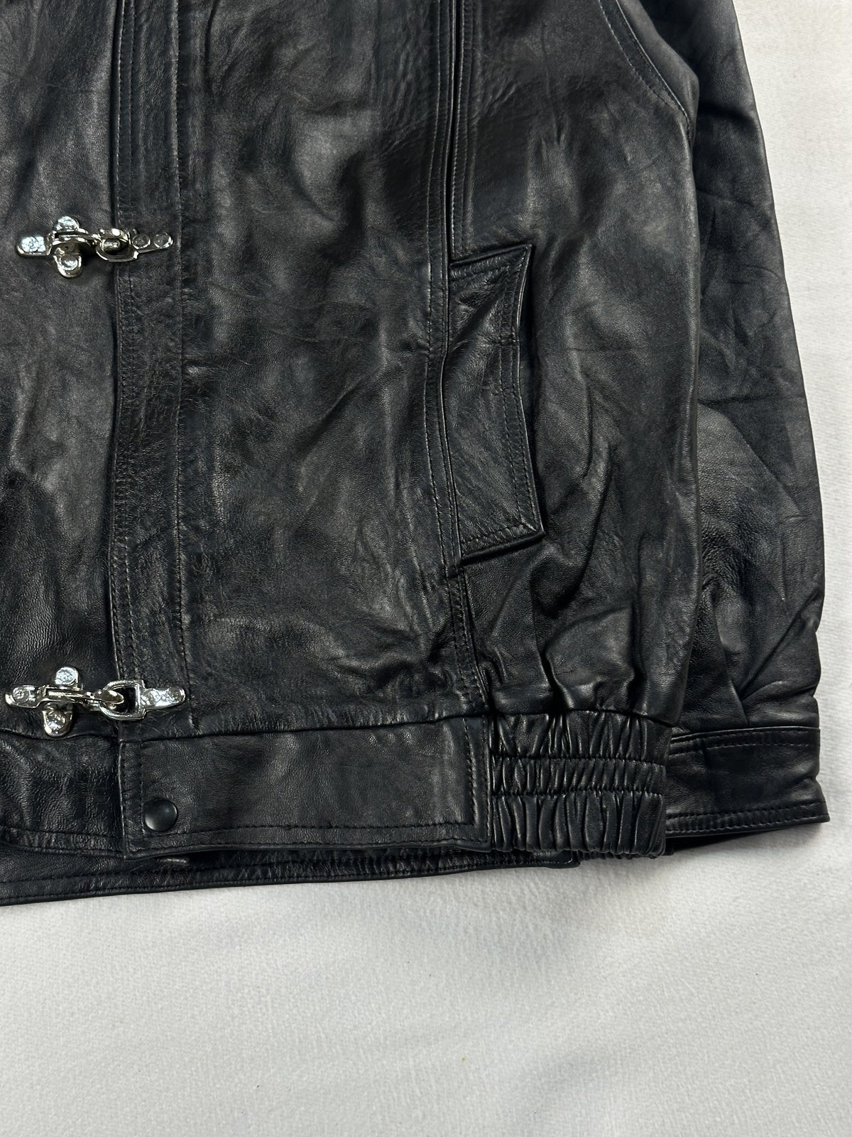 Black leather vintage jacket, size L - size and label context.
