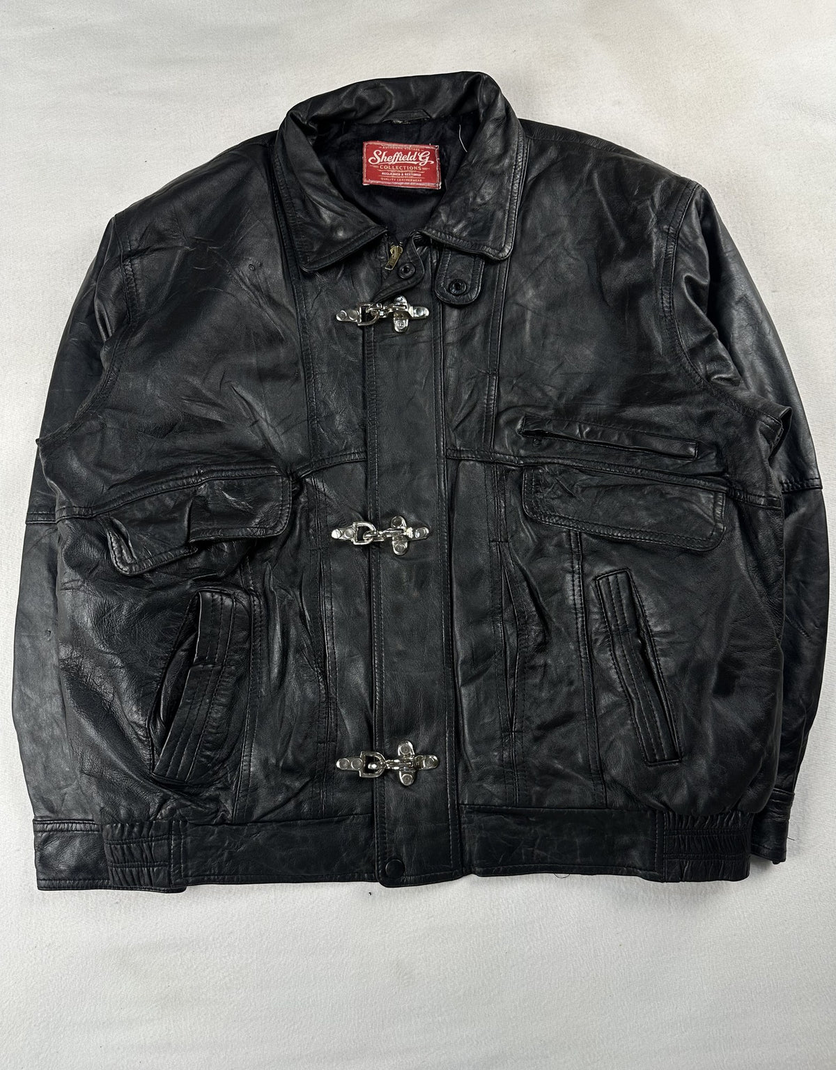 Black leather vintage jacket, size L - chest and pocket detail.