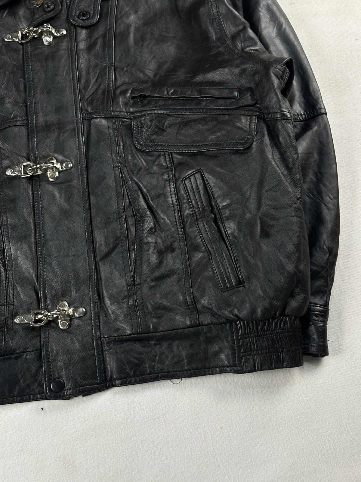 Black leather vintage jacket, size L - size and label context.