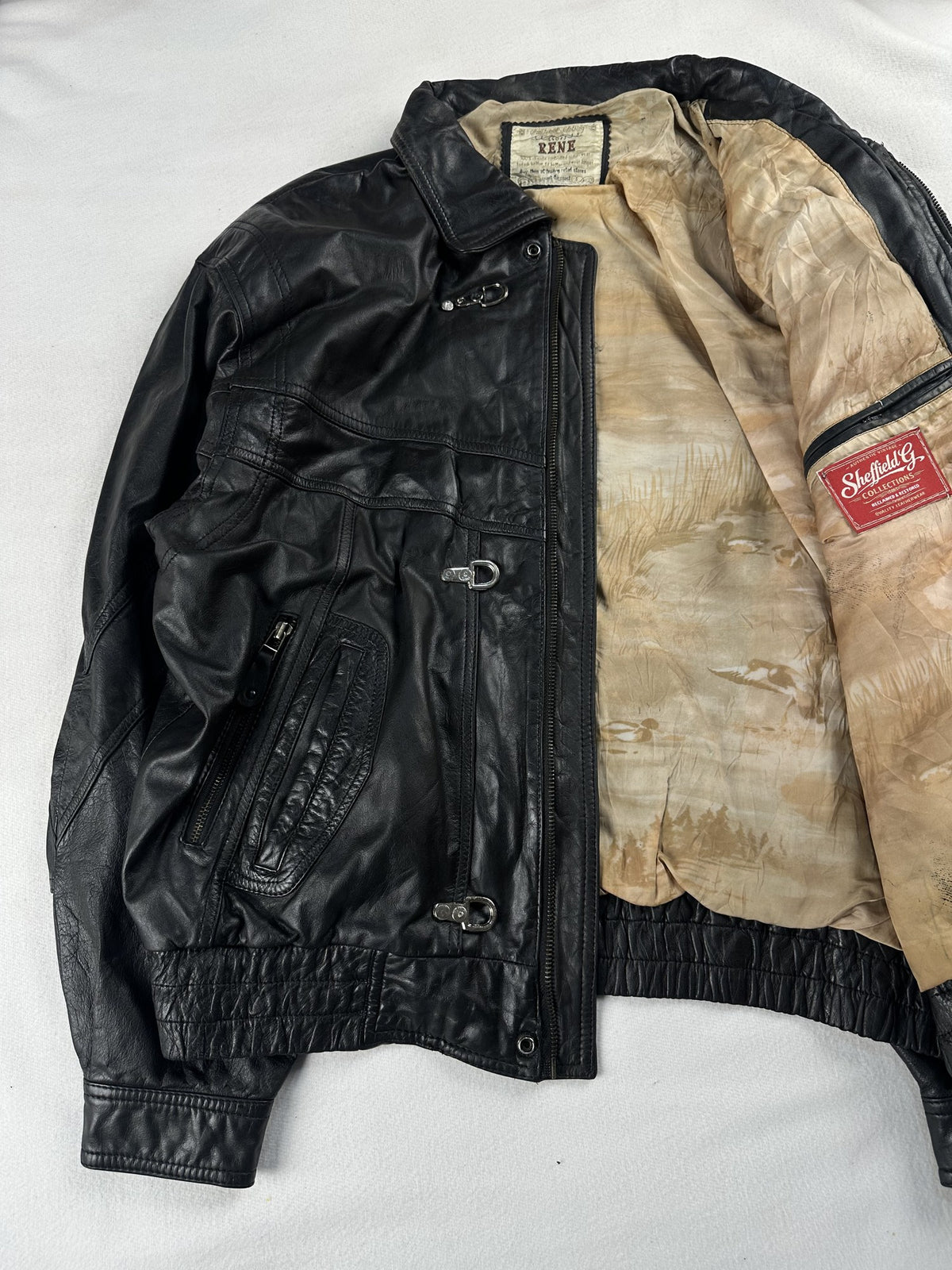 Black leather vintage jacket, size L - cuff and hem detail.