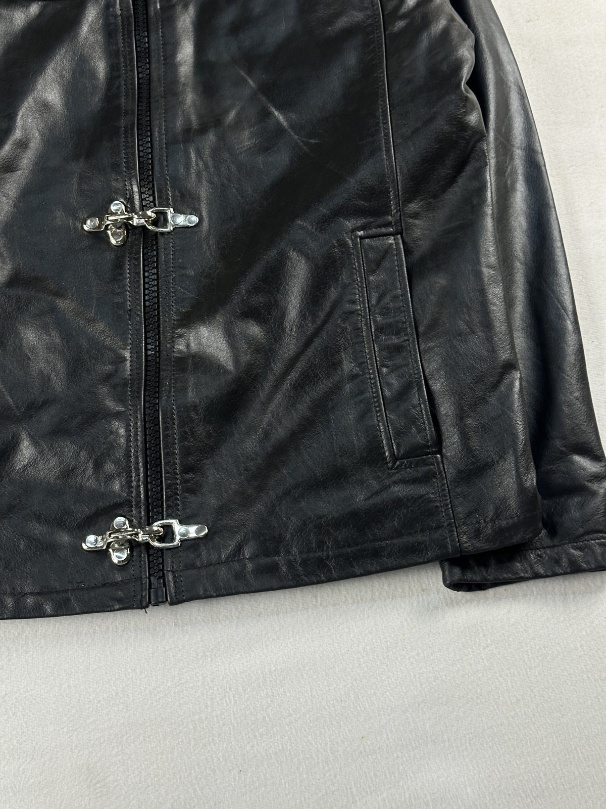 Black leather cafe racer jacket, size M - size and label context.