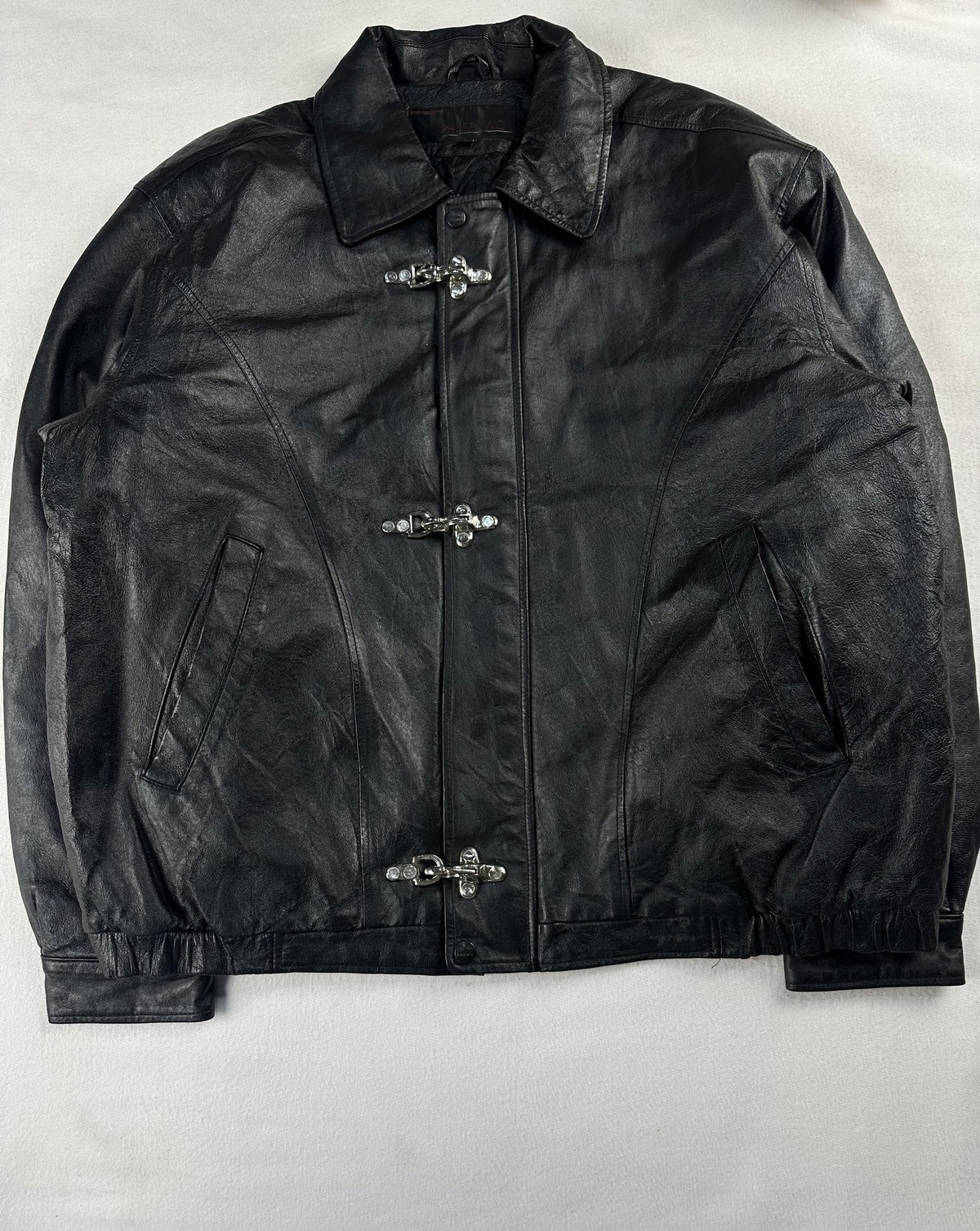 Black leather vintage jacket, size L - chest and pocket detail.