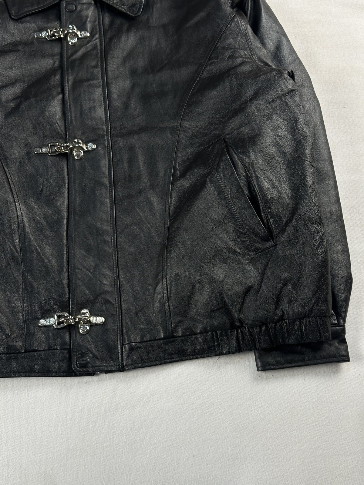 Black leather vintage jacket, size L - size and label context.