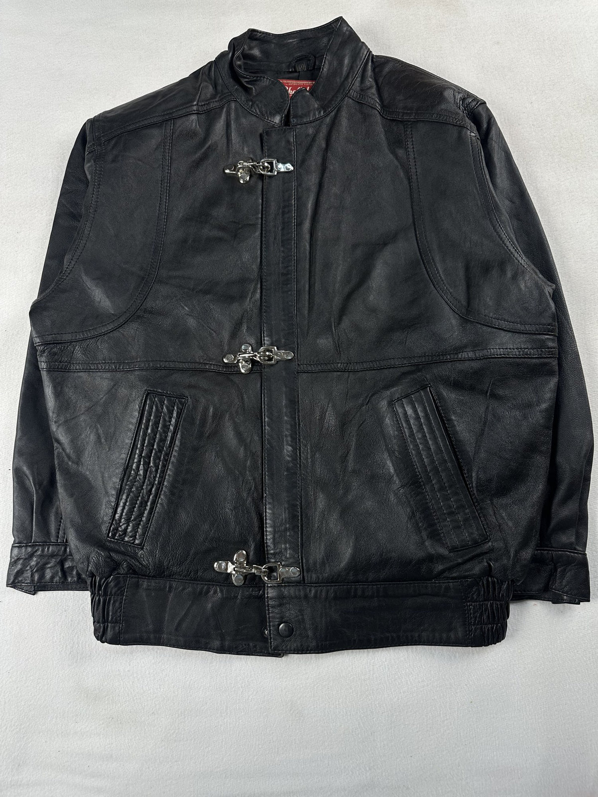 Black leather vintage jacket, size M - chest and pocket detail.