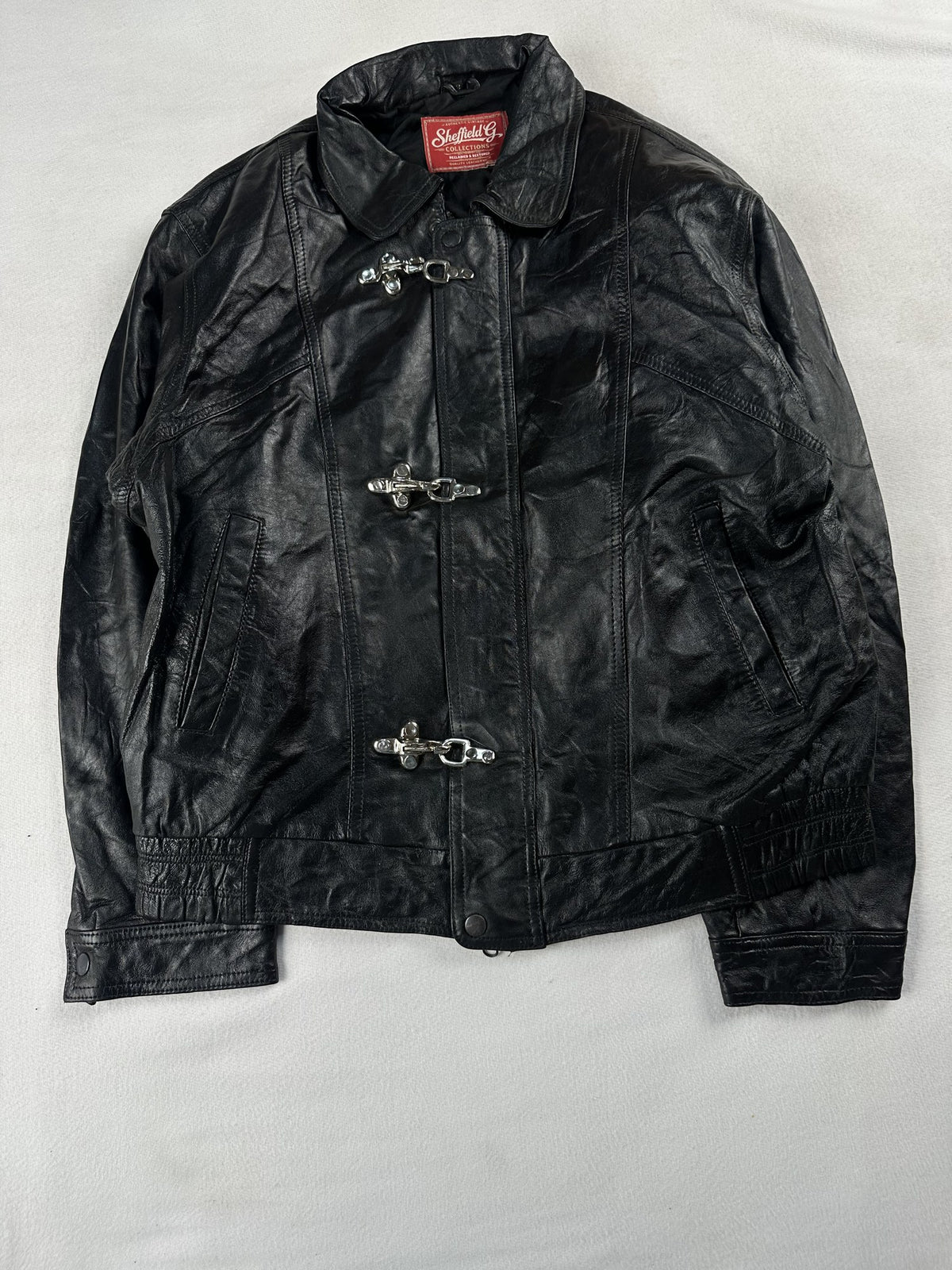 Black leather vintage jacket, size M - chest and pocket detail.
